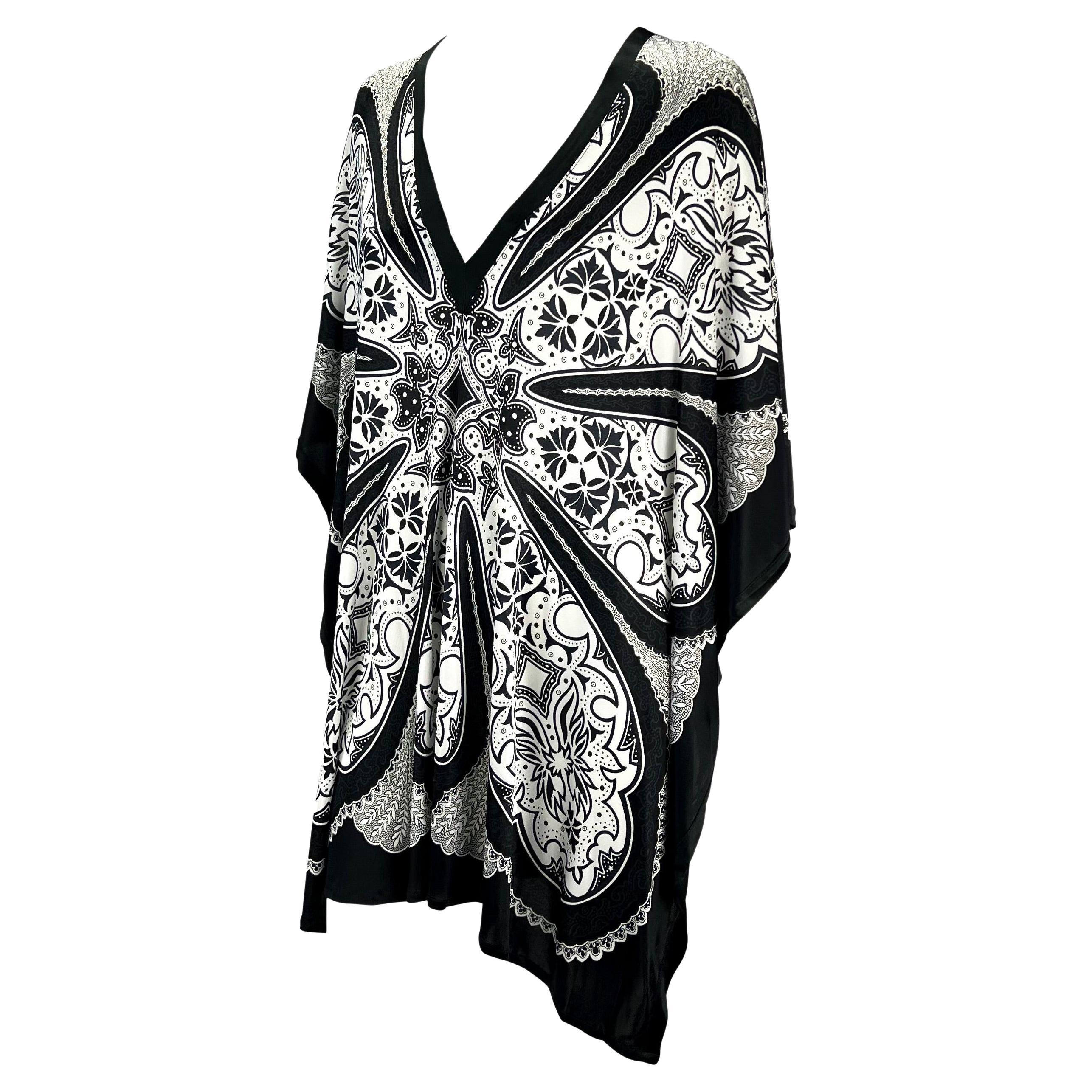 Presenting a fabulous bandana print Gucci cover-up, designed by Tom Ford. From the 2004 cruise collection, this kaftan proudly boasts a black and white bandana print, heavily used in one of Ford's last collections at Gucci. The oversized cover up