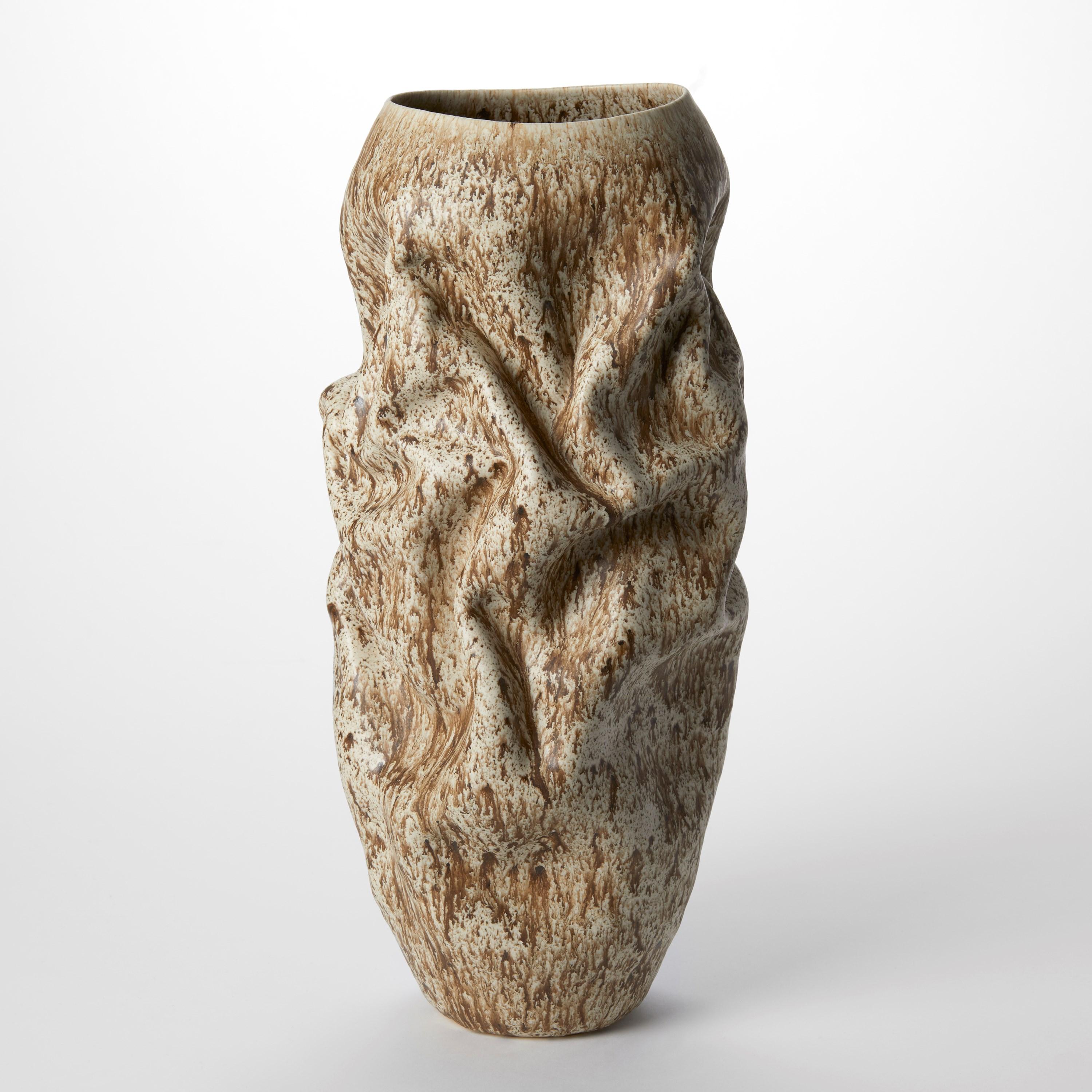 'Crumpled Form with Cream Speckled Glaze No 130’ is a unique sculptural vessel by the British artist, Nicholas Arroyave-Portela.

Nicholas Arroyave-Portela’s professional ceramic practice began in 1994. After 20 years based in London, he moved and
