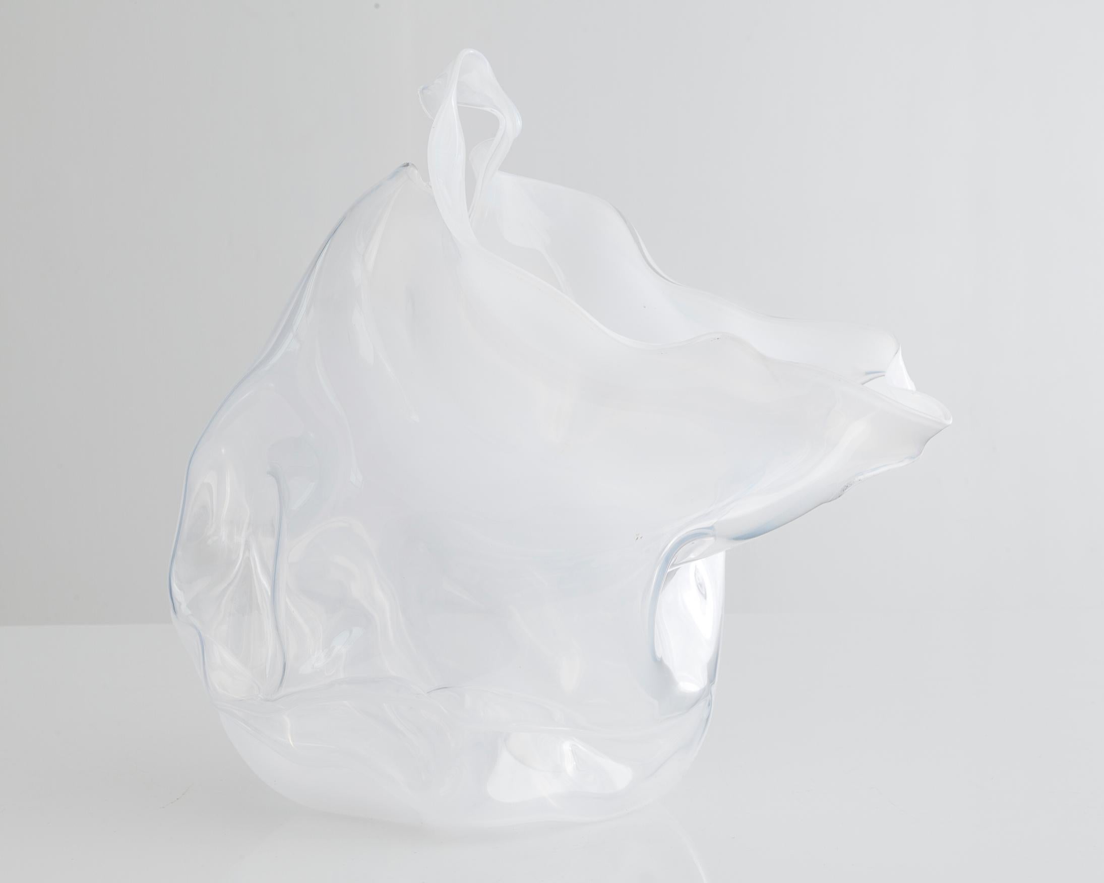 Unique crumpled sculptural vessel in clear hand blown glass. Designed and made by Jeff Zimmerman, USA, 2014.

Limited number available. Please note that each item may differ slightly in color and shape.