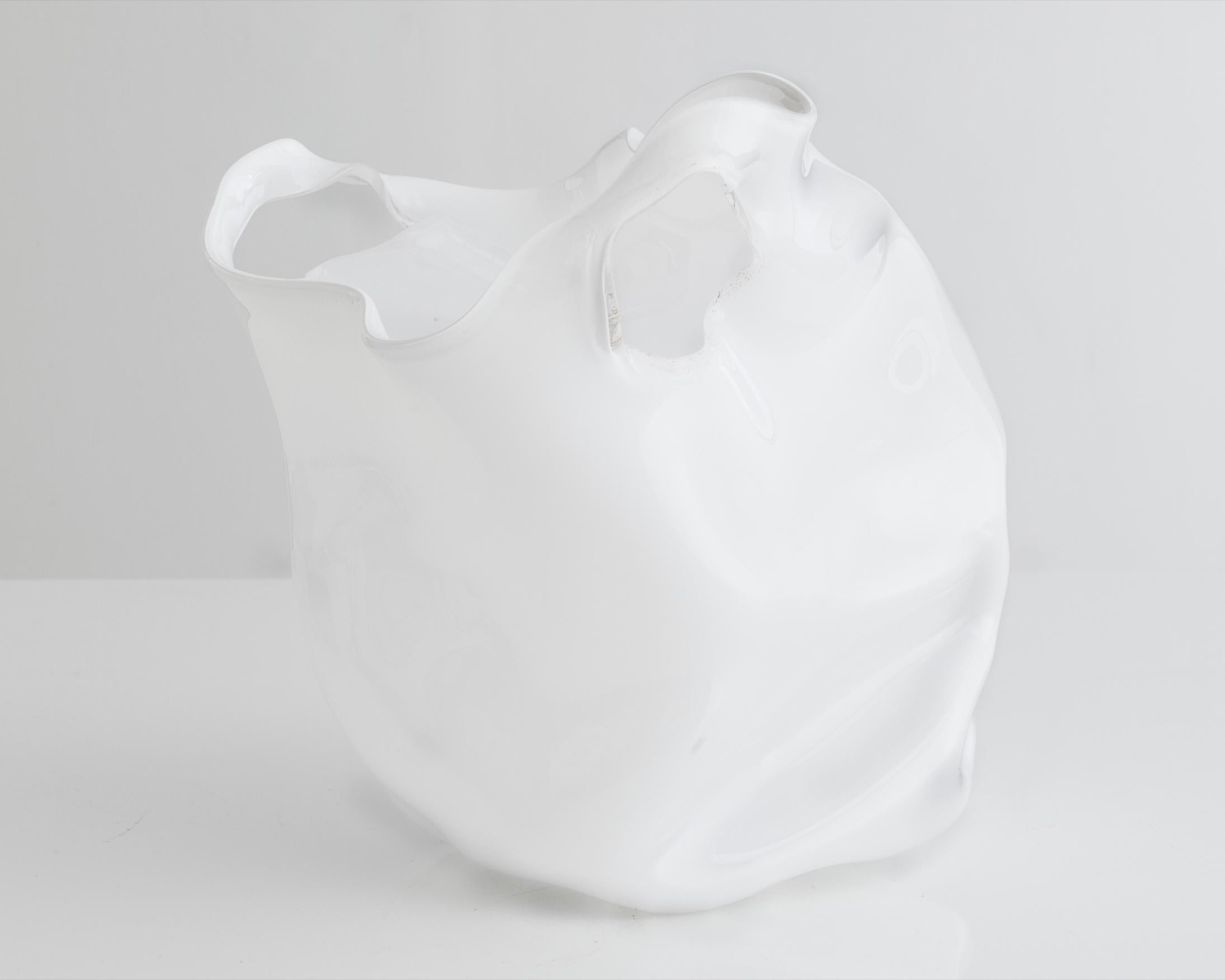Unique crumpled sculptural vessel in white hand blown glass. Designed and made by Jeff Zimmerman, USA, 2014.

Limited number available. Please note that each item may differ slightly in color and shape.