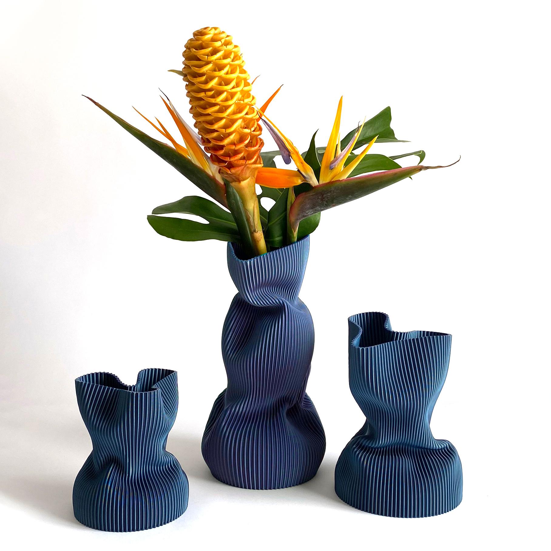 3D-printed in bioplastic and hand-shaped, the Crumpled Vase combines digital precision with expressive craftsmanship. Its sculptural form and delicate texture make each piece a one-of-a-kind creation, individually molded by the artist’s hands.

Made