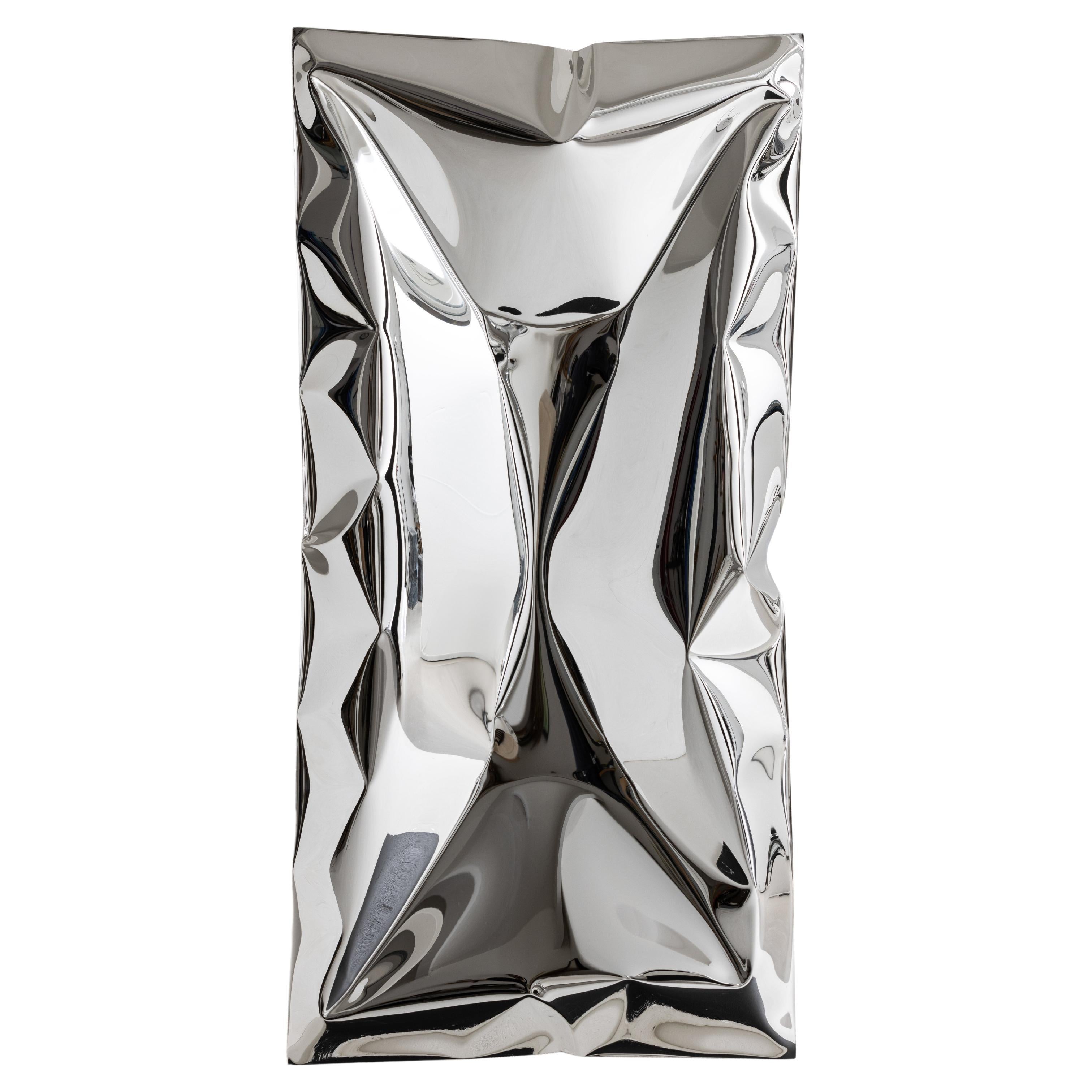 Inflated metal wall artwork, made from highly mirror polished stainless steel. The inflating metal is restricted in areas during forming to create a unique ‘crushed’ aesthetic. As you move around the artwork the myriad of reflections change and