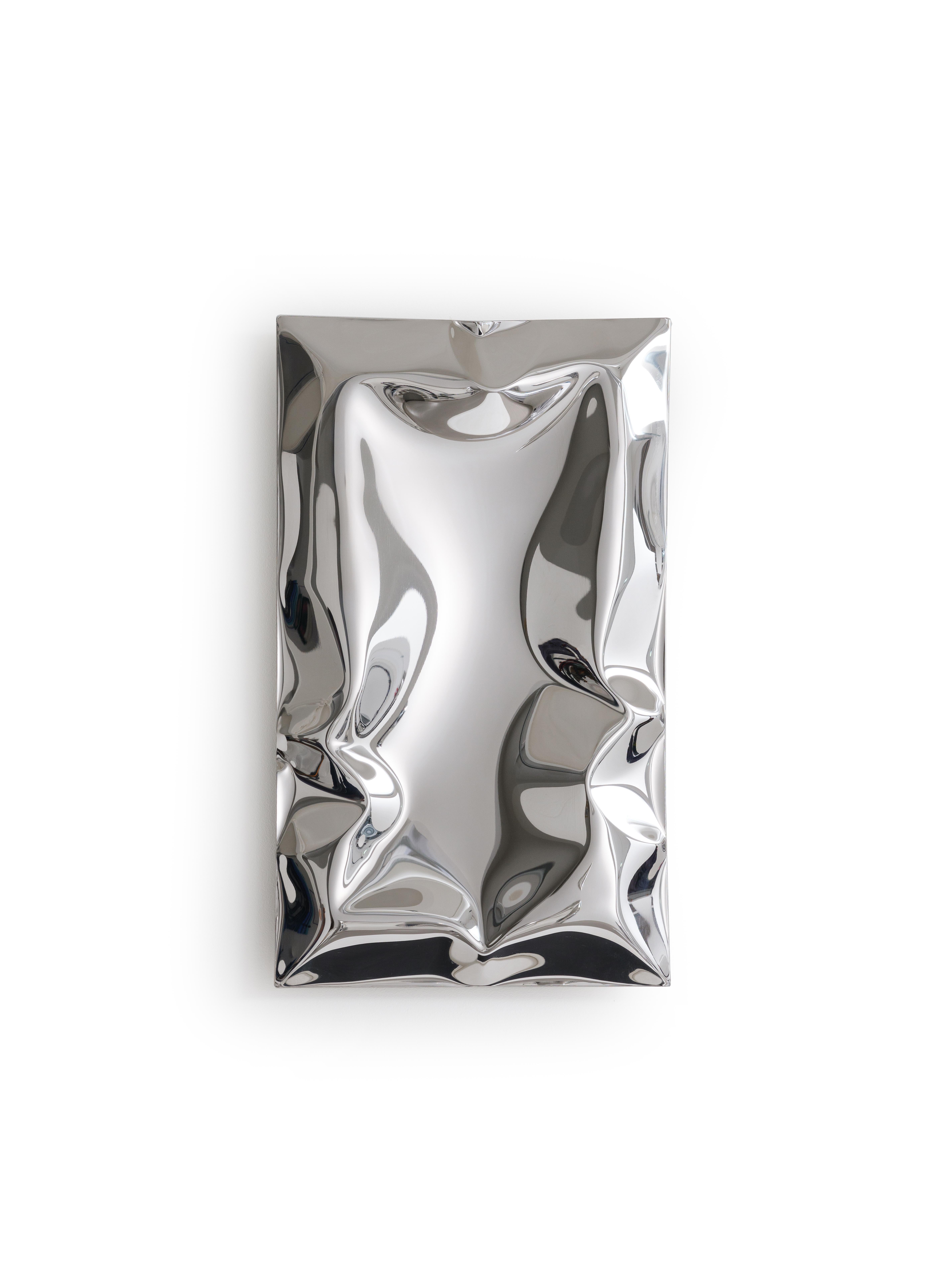Inflated metal wall artwork, made from highly mirror polished stainless steel. The inflating metal is restricted in areas during forming to create a unique ‘crushed’ aesthetic. As you move around the artwork the myriad of reflections change and