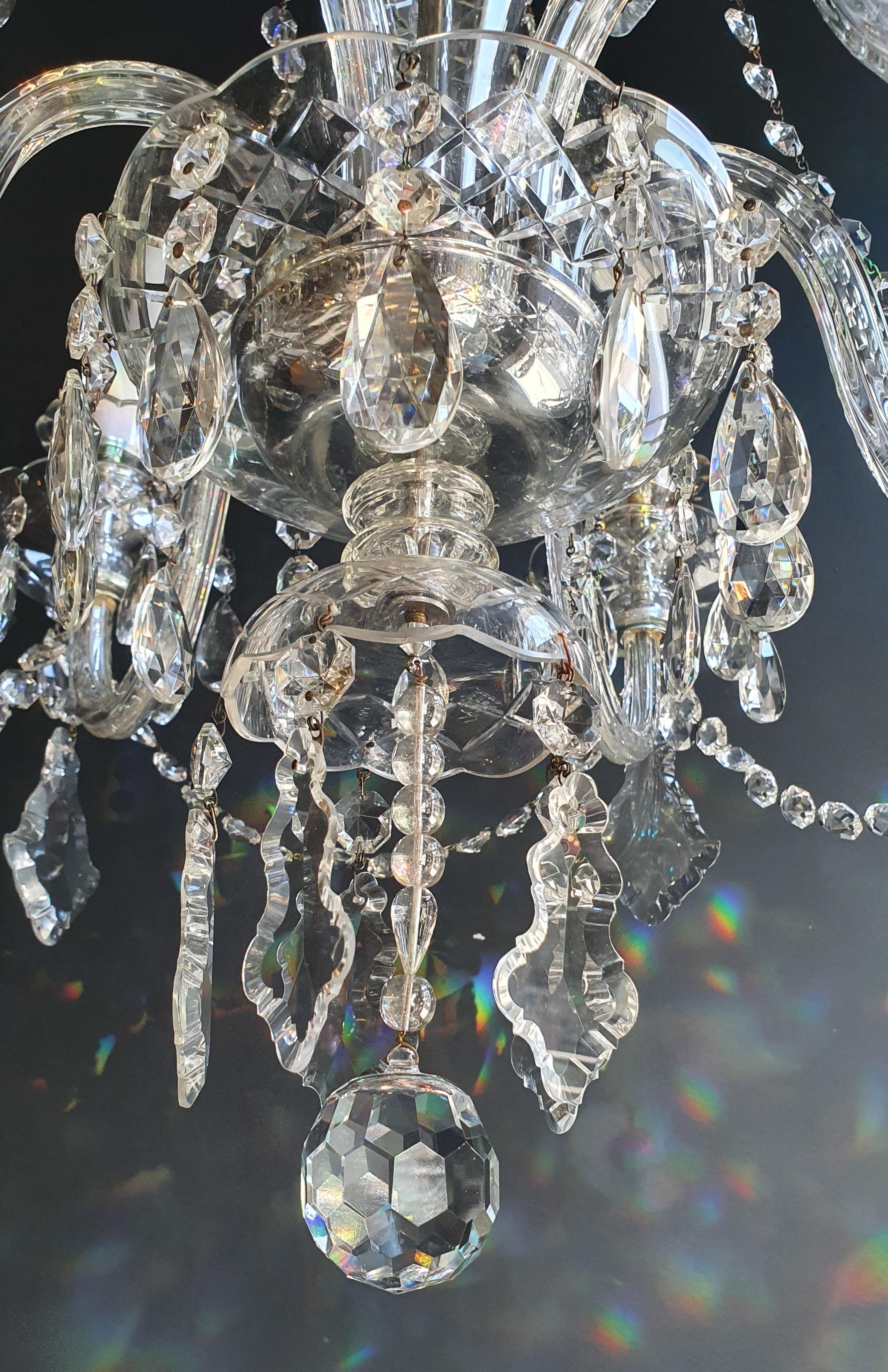 Introducing a stunning Crystal Bohemian Glass Candelabrum Brass Bronze Antique Chandelier in the Luis Art style. This old chandelier has been meticulously restored with love and expertise in Berlin, and its electrical wiring is fully compatible with