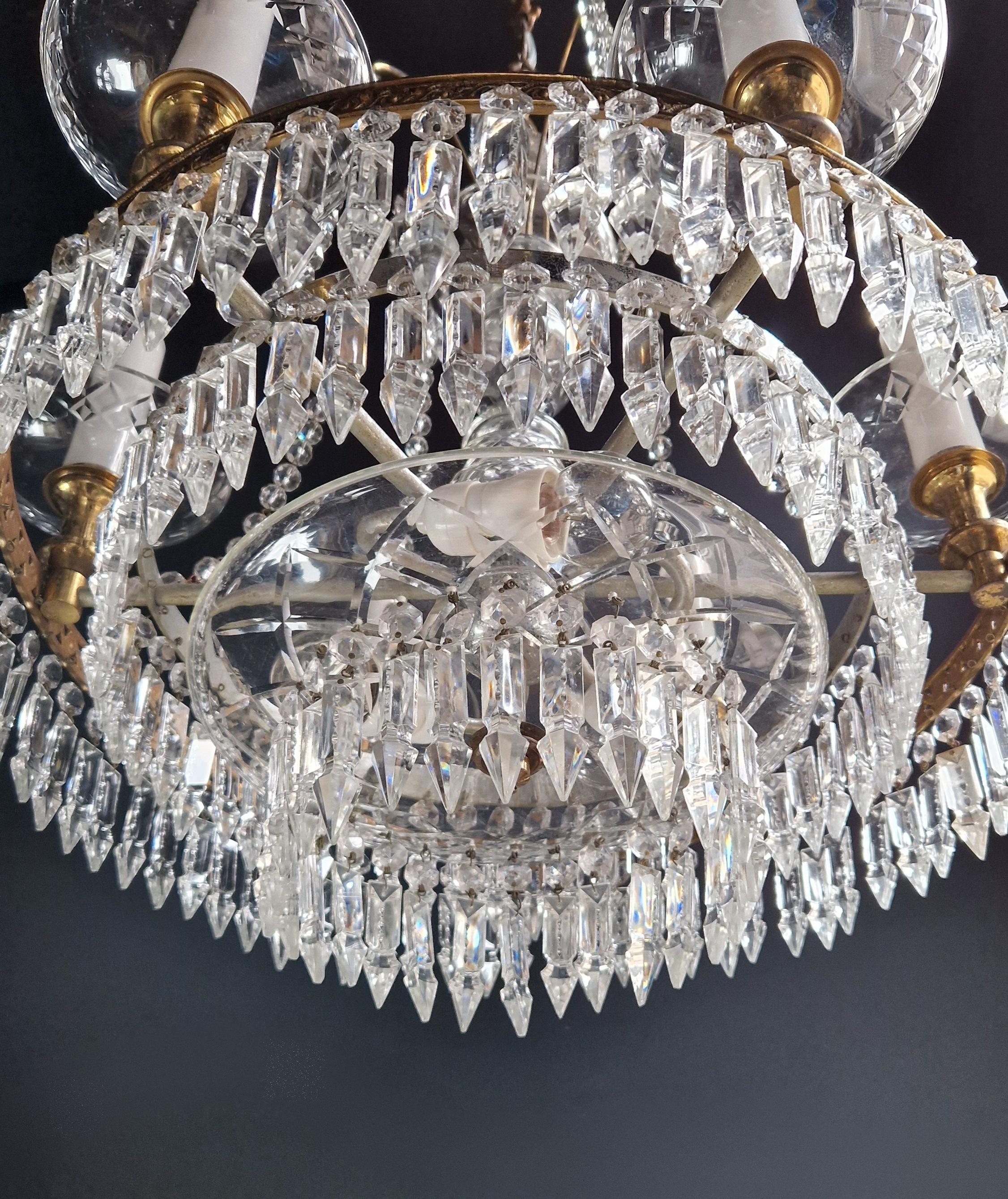 Introducing an exquisite Crystal Bohemian Glass Candelabrum Brass Bronze Antique Chandelier in the style of Luis Art. This chandelier has been lovingly restored in Berlin and is now wired to work with US electrical systems. It has been re-wired and