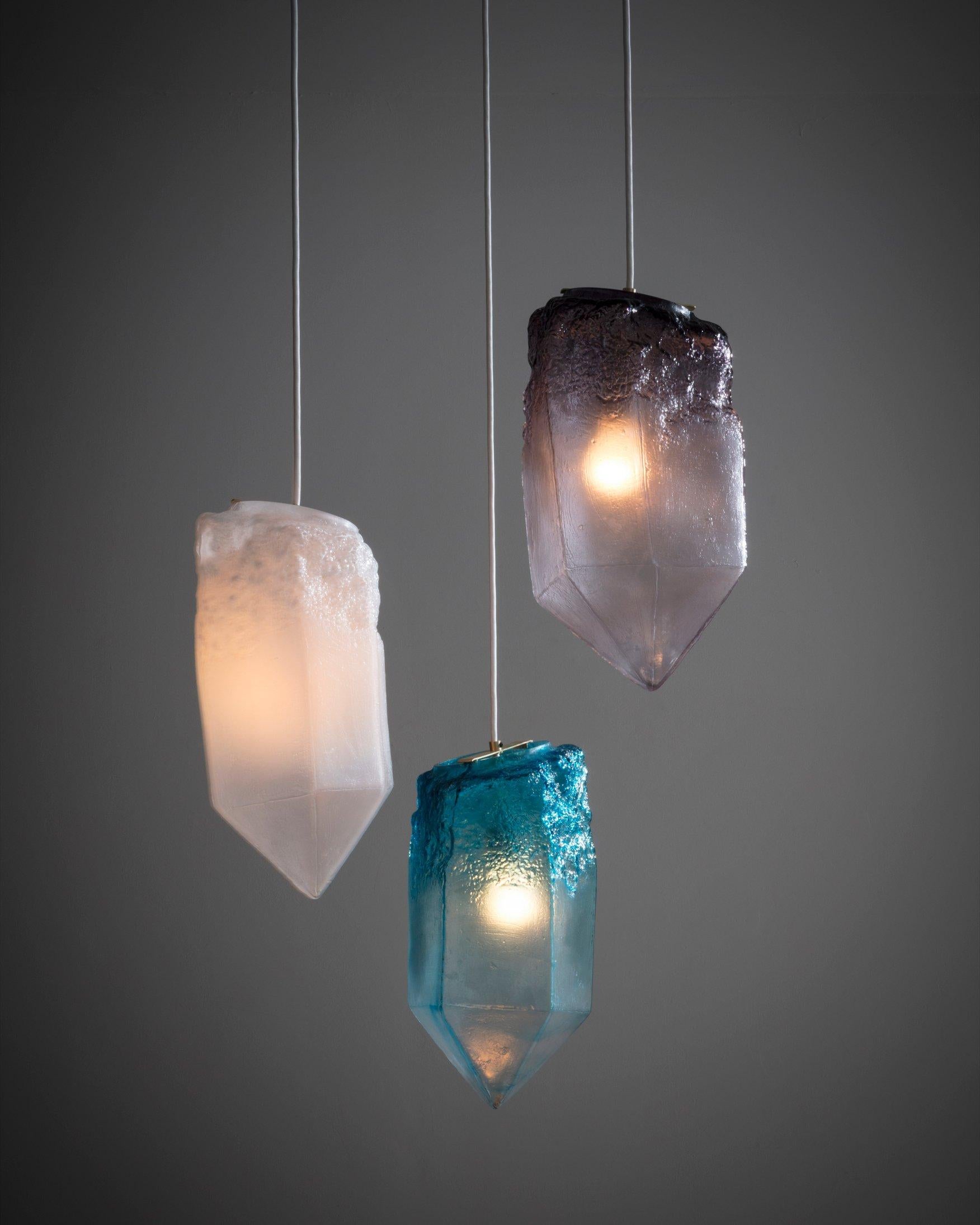 Crystal illuminated sculptural pendant in hand blown glass. Designed and made by Jeff Zimmerman, USA.

Due to the handmade nature of this piece, color, size, and shape may vary slightly.