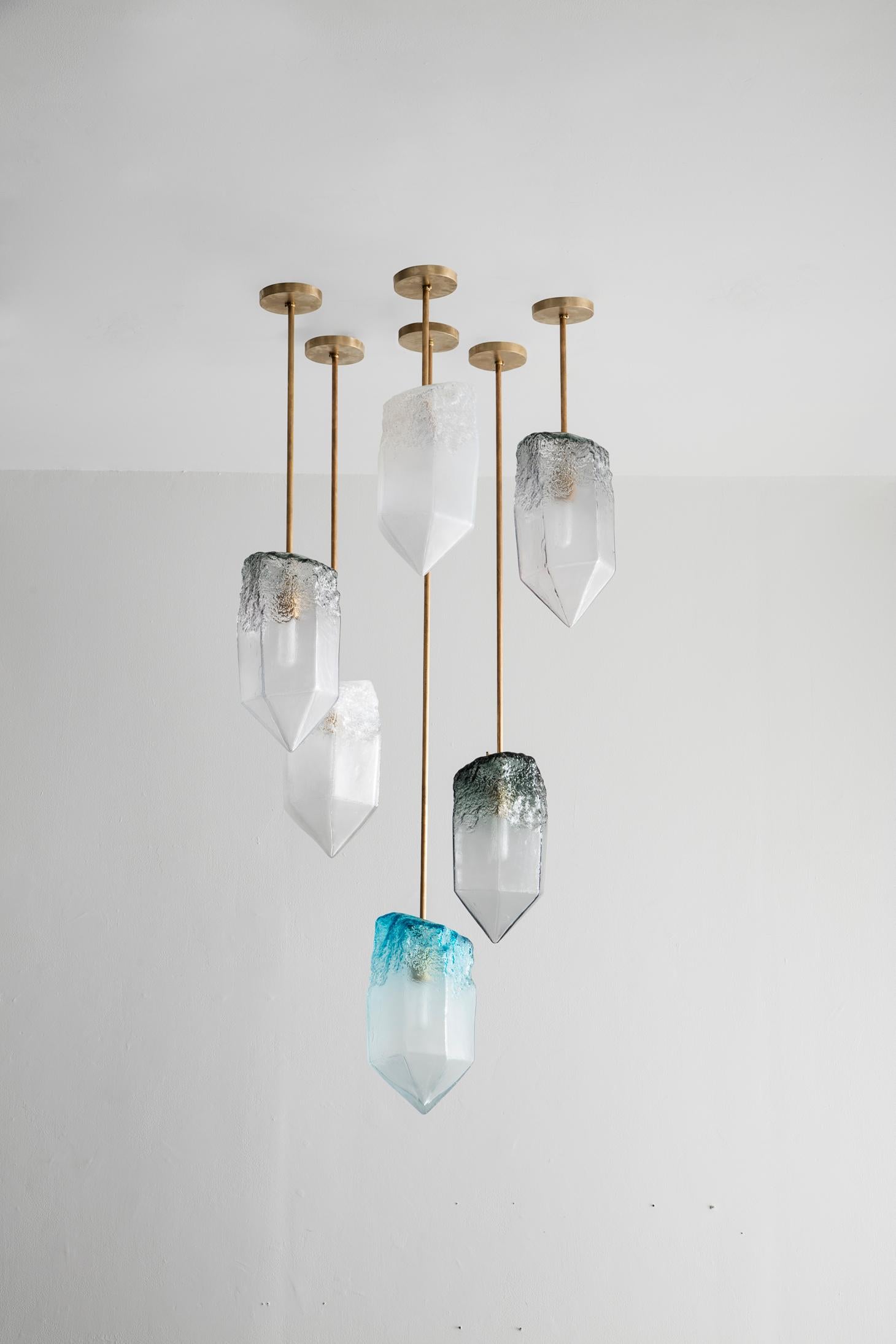 Crystal illuminated sculptural pendant in hand blown glass. Designed and made by Jeff Zimmerman, USA.

Due to the handmade nature of this piece, color, size, and shape may very slighty.