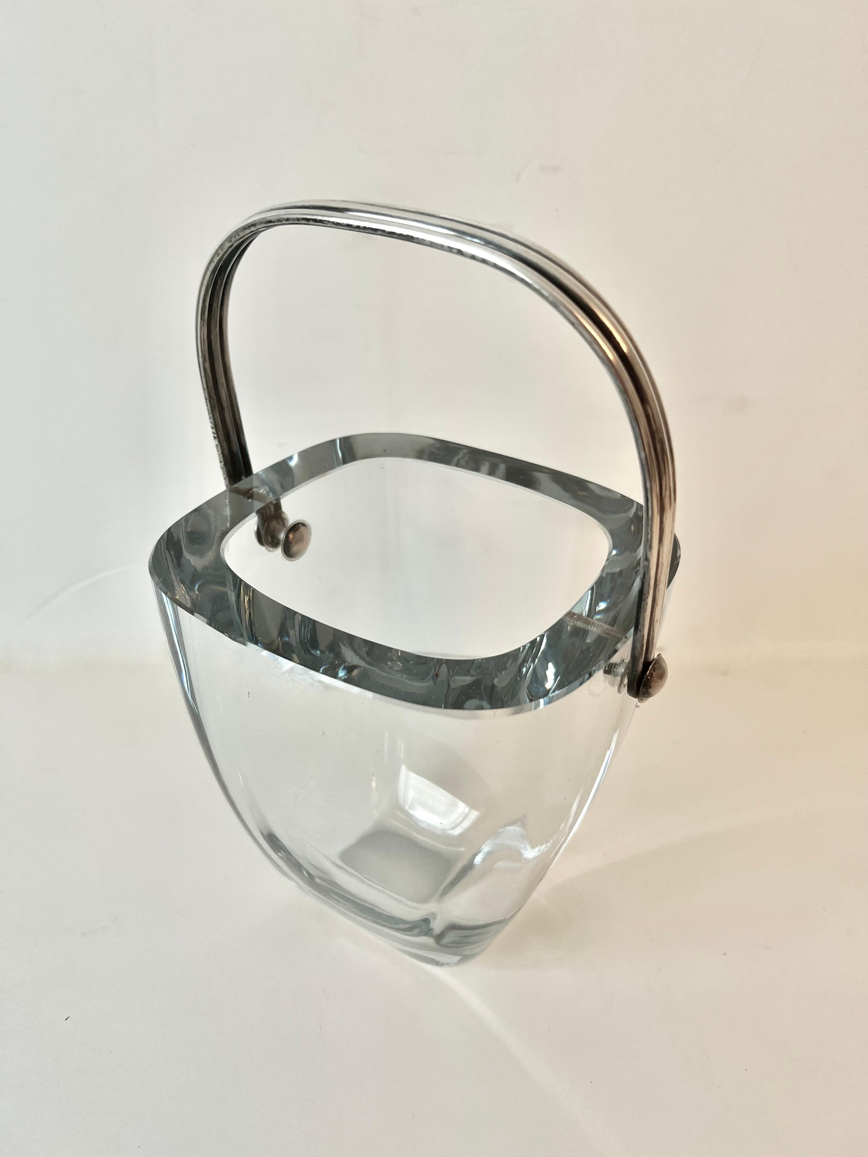 A stunning Tiffany and Co. Art Deco Crystal ice bucket with sterling silver handle.  The crystal is a beefy 3/4