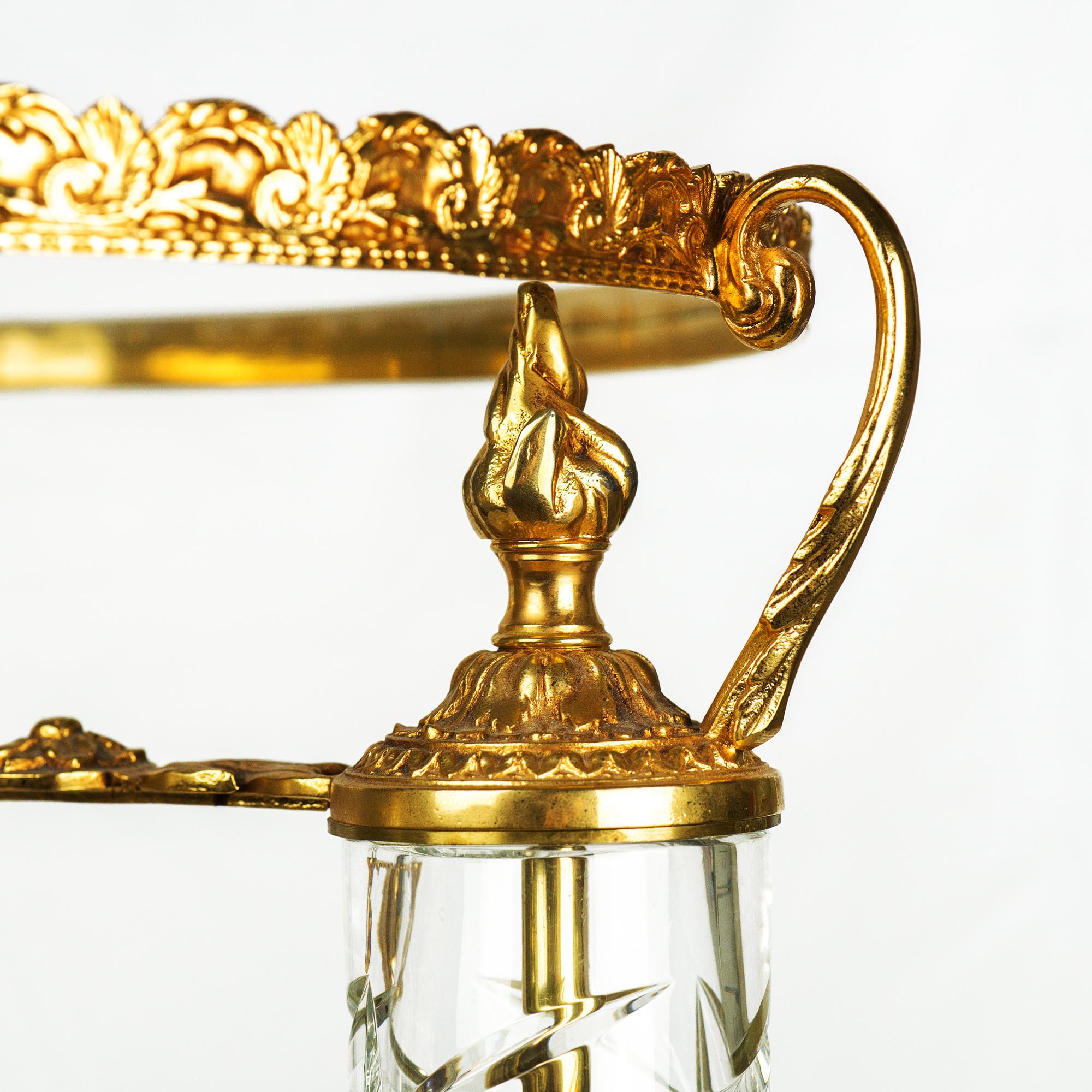 Crystal and bronze guéridon table covered with 24-carat gold.
Measurements: H. 100 cm x D. 40 cm

Last piece from a previous collection, in good condition.
The crystal is blown mouth and handcut in our factories in Eastern France.
Bronze work