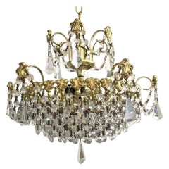 Lampadario in cristallo e ottone lucido