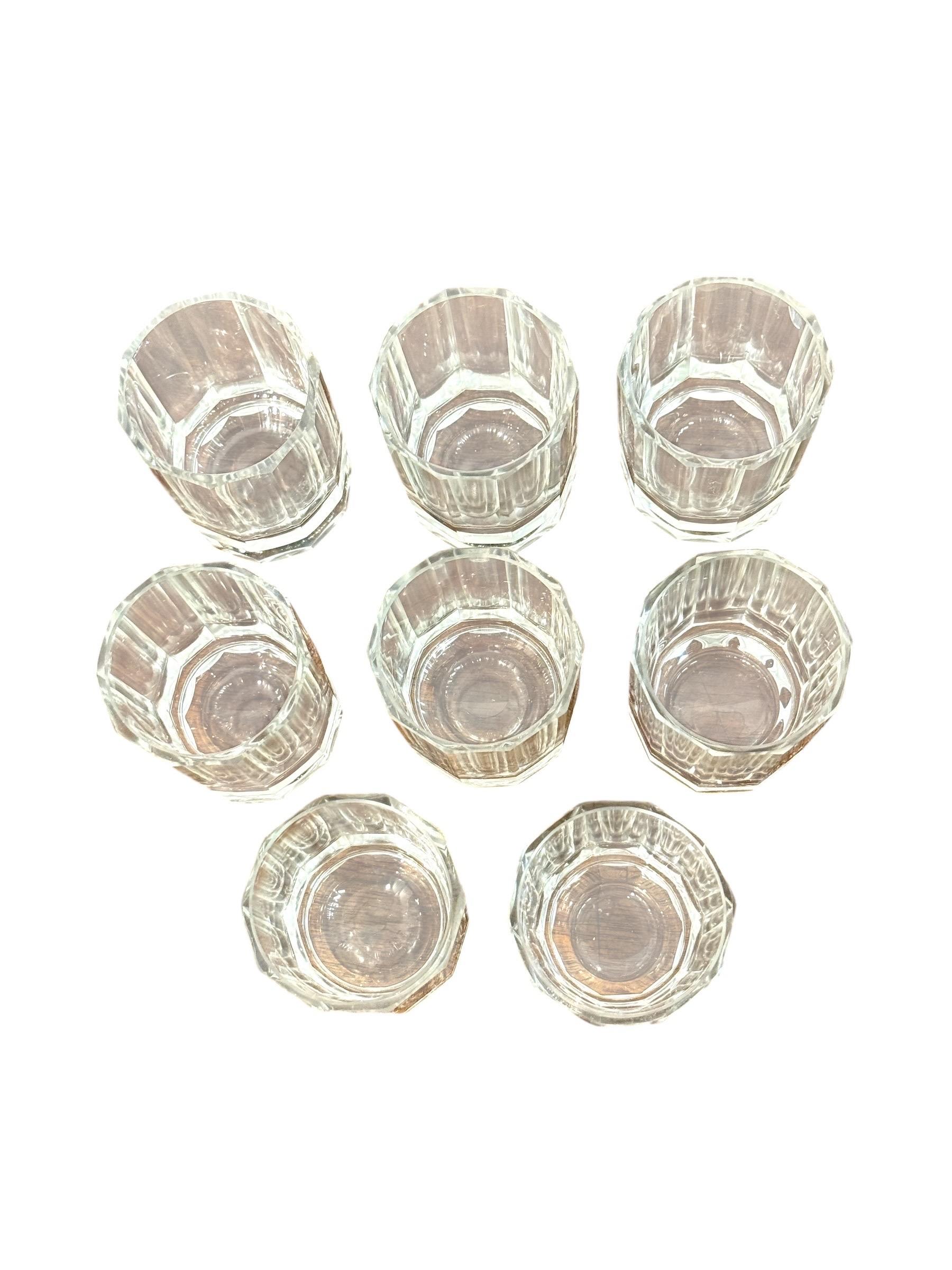 This elegant liqueur service, dating from the late 19th to early 20th century, reflects the refined artistry of European crystal production during the Belle Époque and early Art Deco era. The set is composed of a substantial crystal decanter,