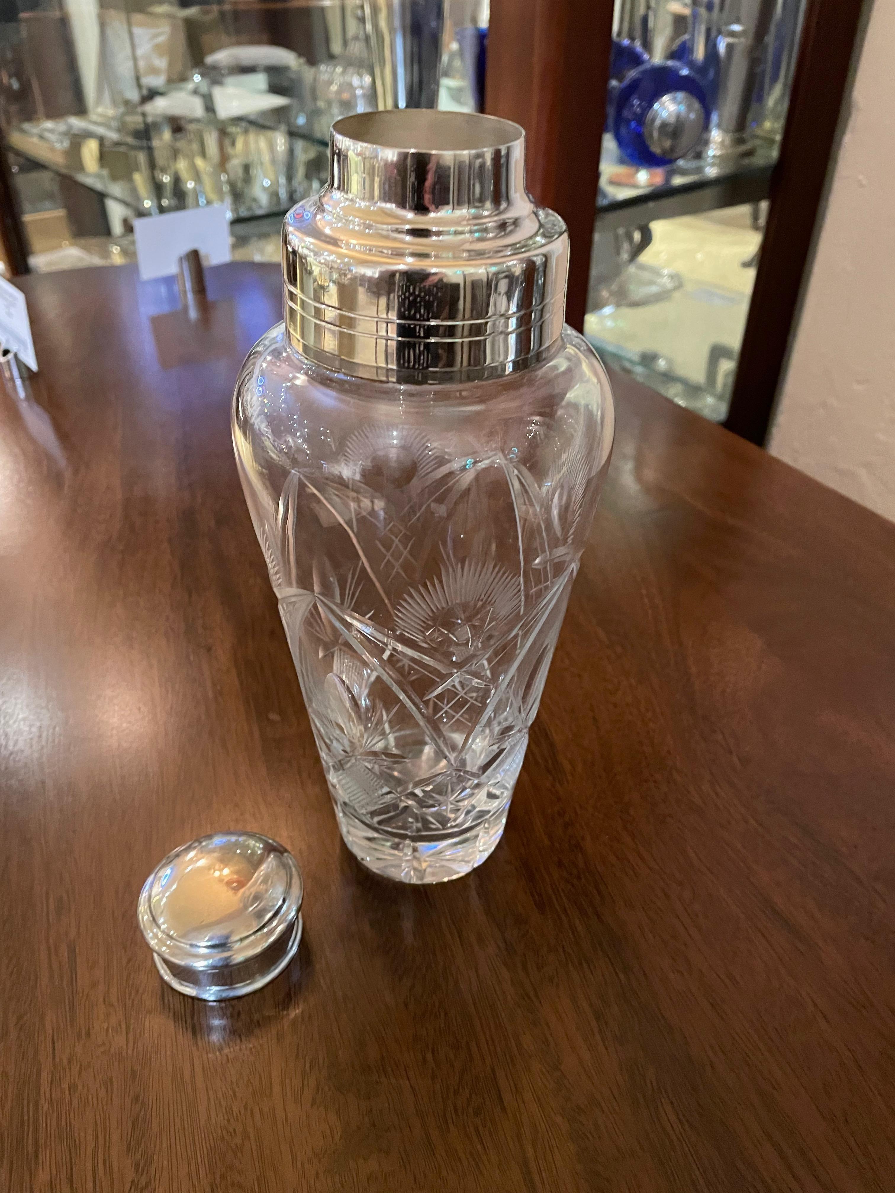 A cut crystal shaker with a silver top, would be a fine addition to any collection but might be perfect for the lady on your gift list that is a cocktail aficionado as the beautifully engraved crystal done in the Czech tradition adds a special