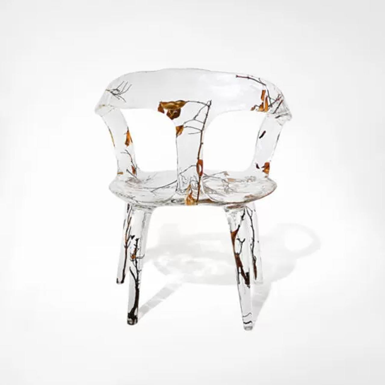 The Branched Crystal Arm Chair embodies style, sophistication, and artistic craftsmanship. Crafted from sleek crystal mixed with acrylic and adorned with real wooden branches, this armchair is a true work of art. Its museum-quality design makes it