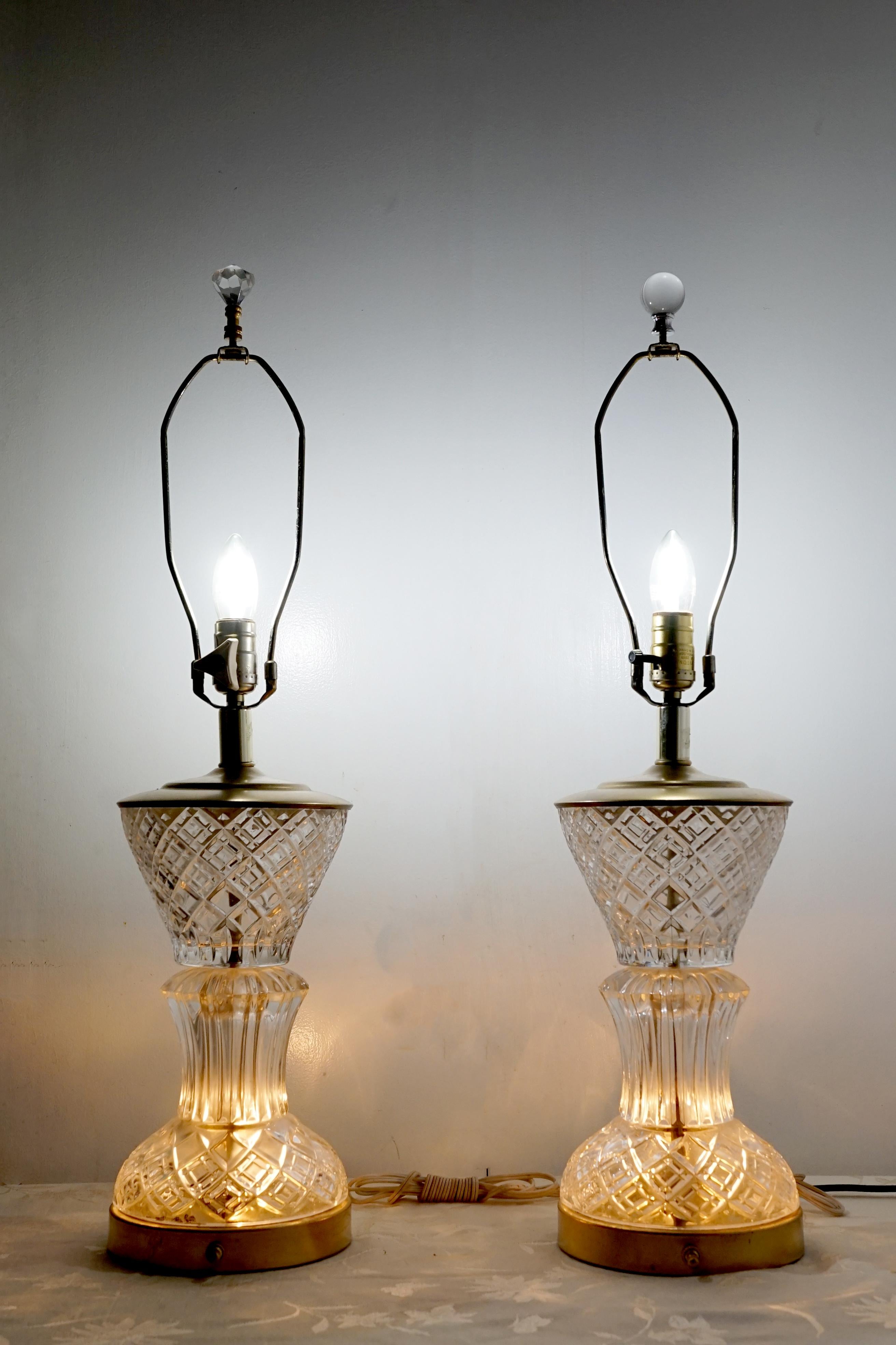 Art Deco shape, style and sparkling faceted cut crystal create a lighting statement in this pair of lamps circa 1925 to 1940. They were produced in the U.S. or France.
The condition is quite good, and the lamps present beautifully. Their appearance