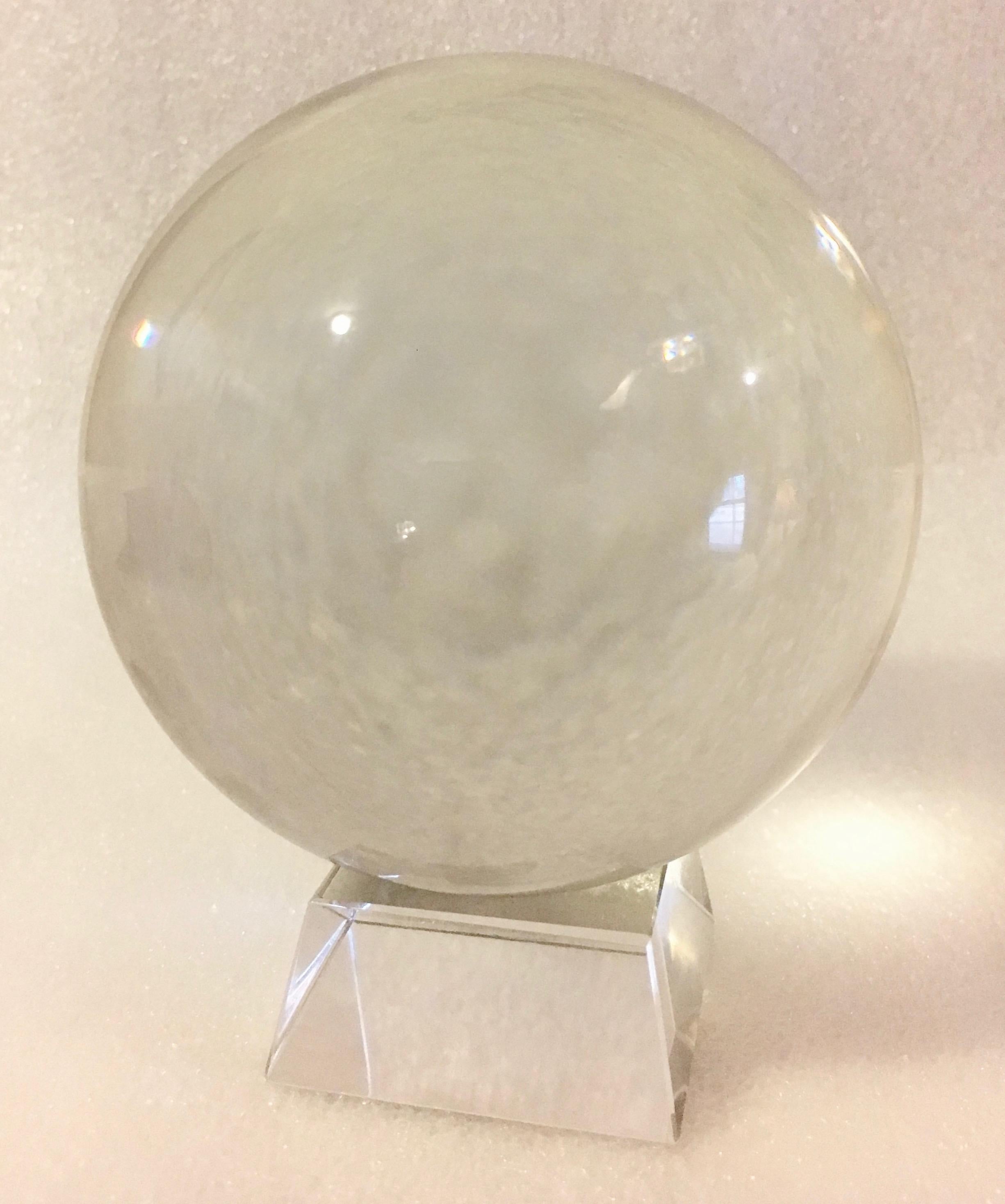 Crystal ball on acrylic stand - a handsome bookend, or terrific paper weight - or just look into the future Dorothy! - the ball is glass and clear.