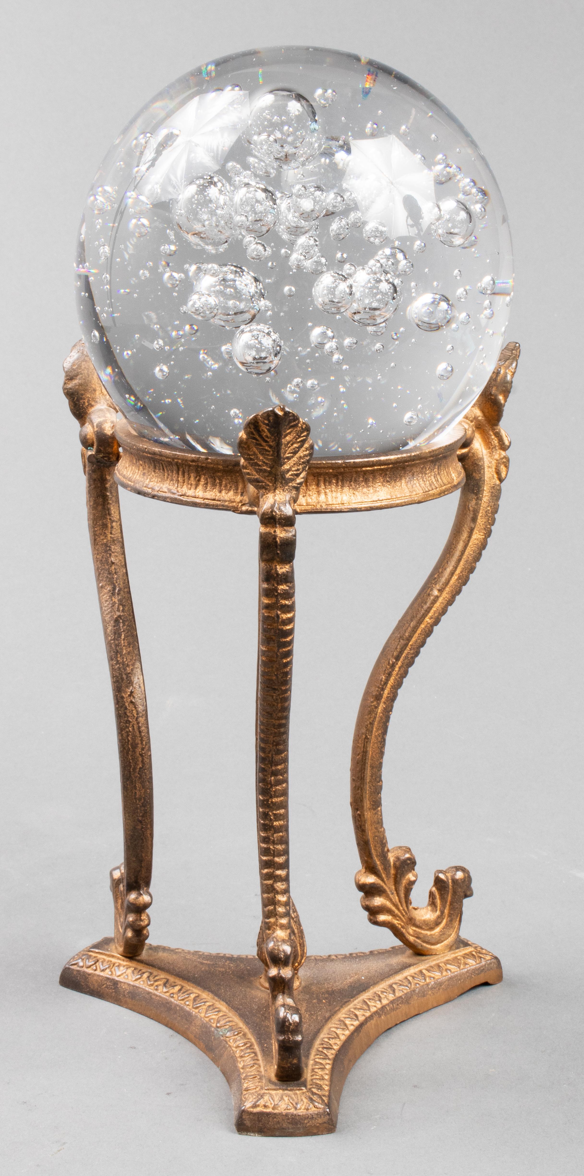 Crystal ball with controlled bubbles, on tripod metal stand with scrolled legs. Measures: Crystal 4.5