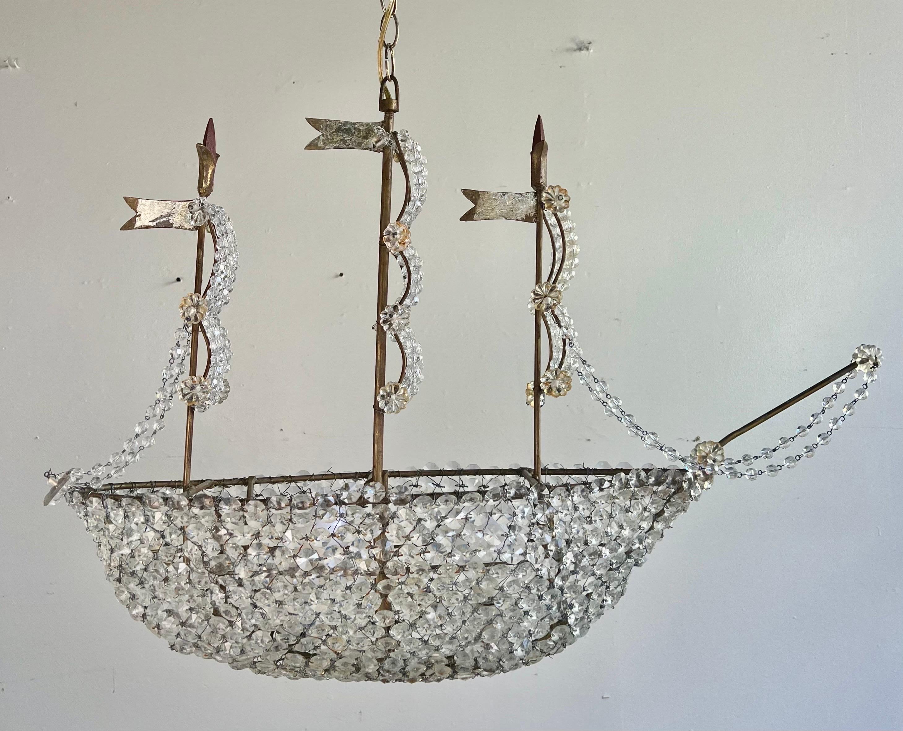 Handmade by Melissa Levinson & Co.  We use the best crystal and crystal beads.
The beads form a ship with three sales blowing in the wind.  This whimsical fixture is all handmade and took weeks to make.  It is quite a beauty. We incorporate
