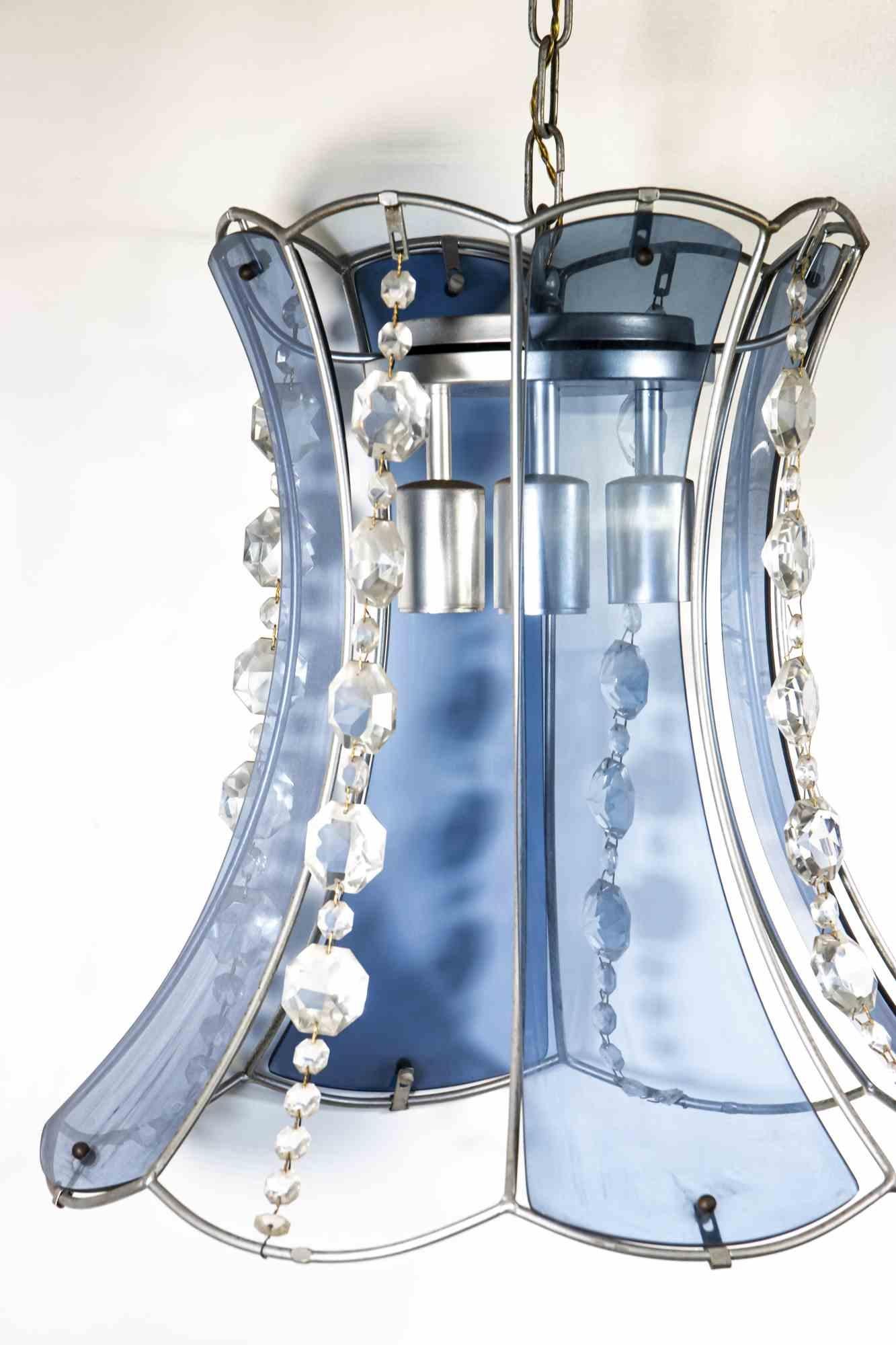 Crystal blue chandelier is an original design lamp realized in the half of 20th century by Italian designer.

A very elegant chandelier composed by blue Murano glass and embellished with crystal drops

Mint conditions.

Decor your room with