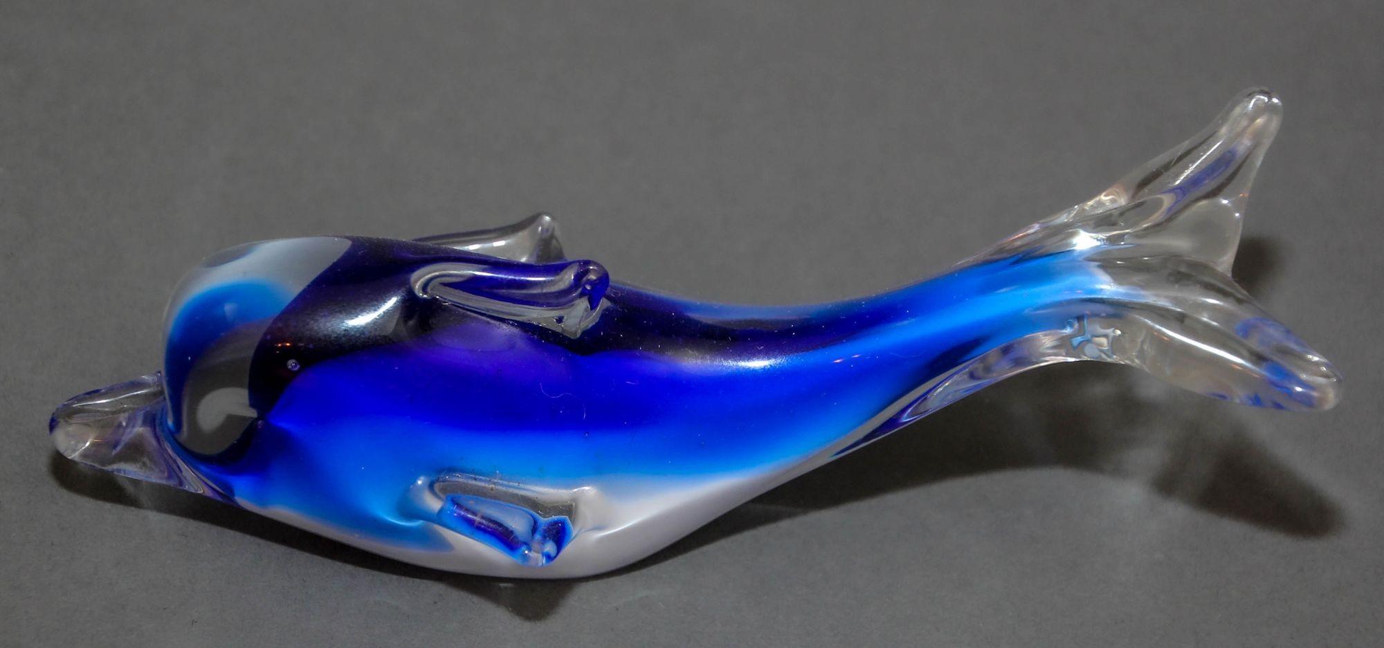 Crystal Blue Dolphin Murano Art Glass Paperweight.
The dolphin or porpoise is handmade in clear and blue blown glass.
Hand made and mouth blown in Italy, Murano art glass sommerso style figure or sculpture of a dolphin in a very vibrant cobalt blue