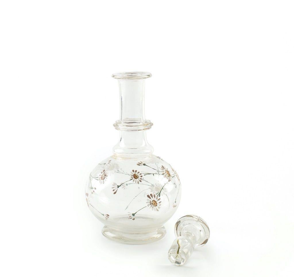 Crystal bottle, with floral decorations on the base and crystal cap, realized in Northern Europe between the 1930s and the 1940s.

Very good conditions.