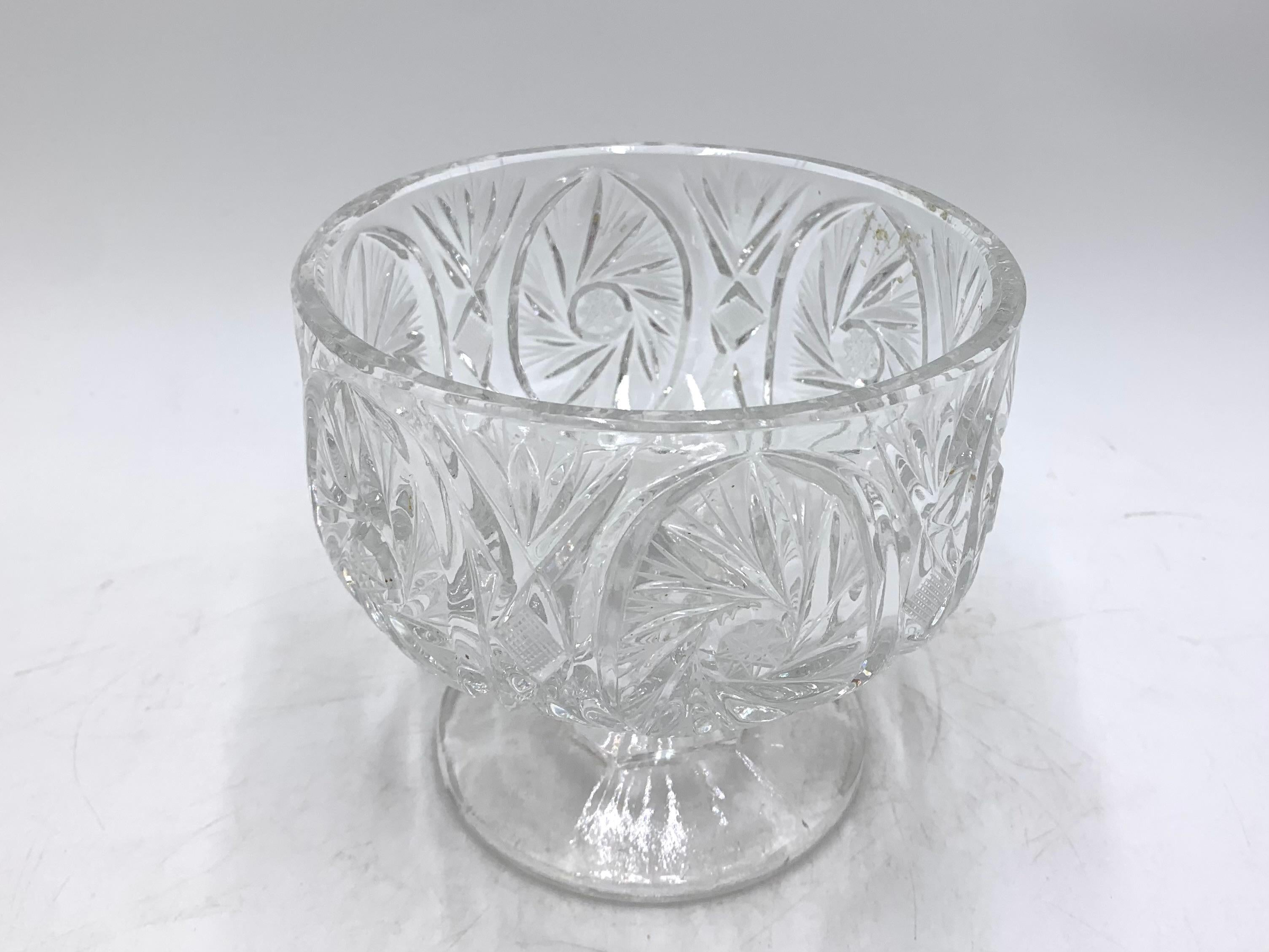 Crystal clear bowl on a stem, perfect for sweets or small fruits. 
Produced in Poland, in 1960s. 
Very good condition.
 