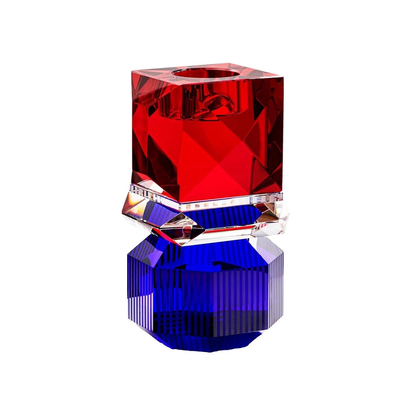 Crystal candleholder available in two colours: Amber/Transparent/Black and Red/Transparent/Cobalt. The balance between the transparency of the crystal and the glow of the candles creates a visual harmony that evokes a sense of calm and well-being.