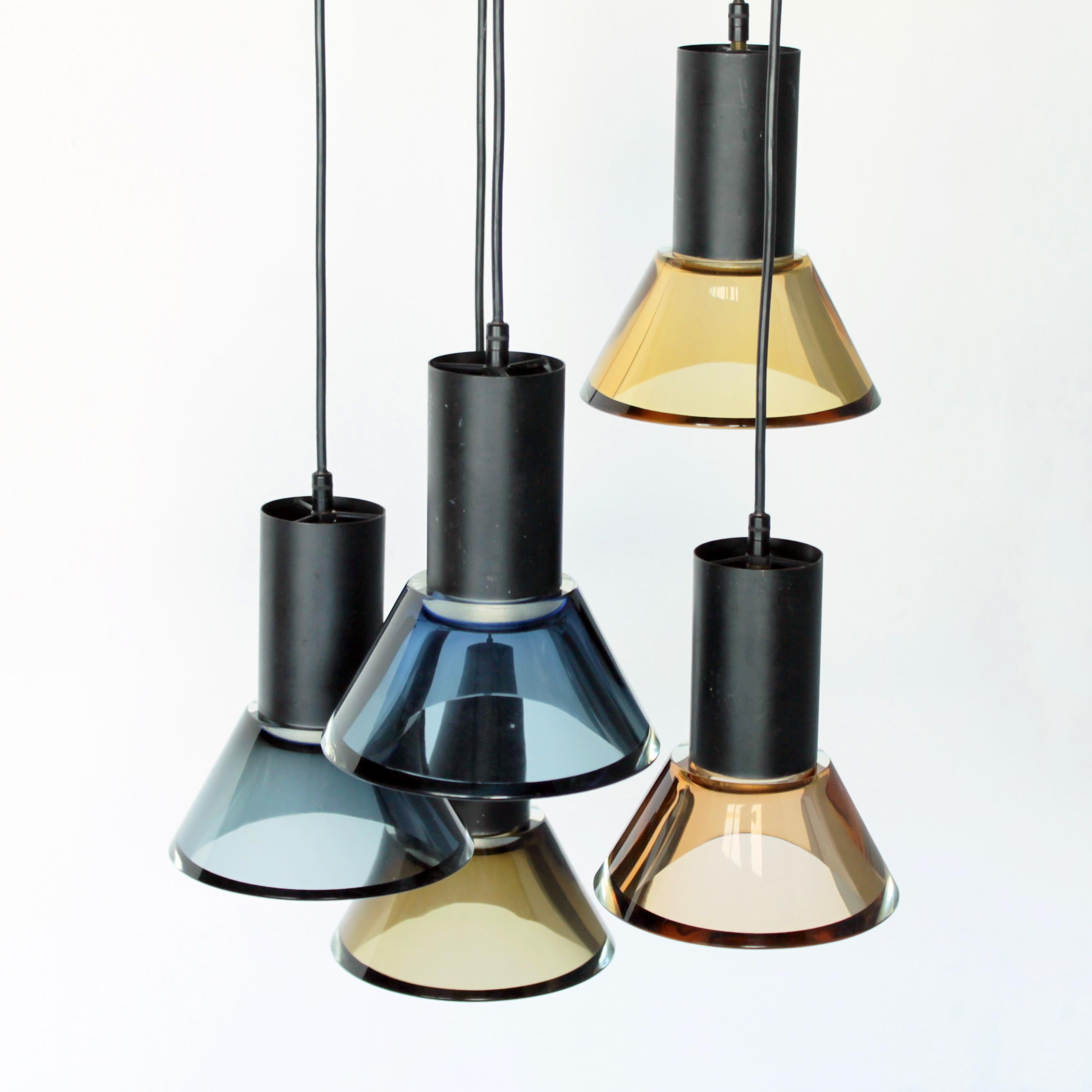 Five Murano glass fixture by Flavio Poli for Seguso Vetri d'Arte, Murano, Venice Italy. Brass fixture and solid glass in stunning subtle colors, from yellow till blue.
Total length a light (metal cylinder with the glass): 7.7 in. (19,5 cm), height