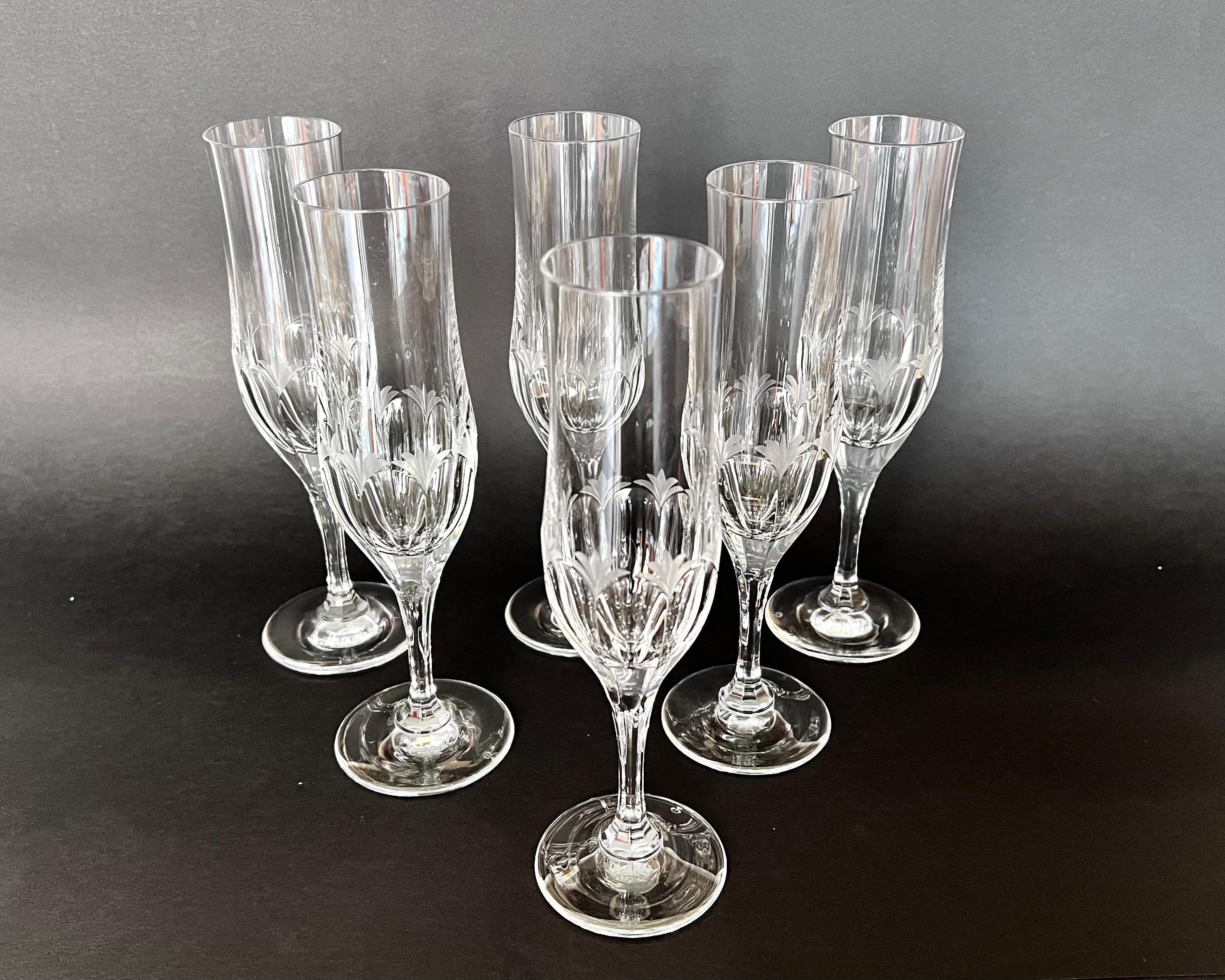 Crystal champagne flute glasses, Germany, 1980s. Stamped.

The vintage set consists of six classic champagne glasses made of durable etching crystal with diamond cutting.

Products are equipped with high legs and are designed for serving