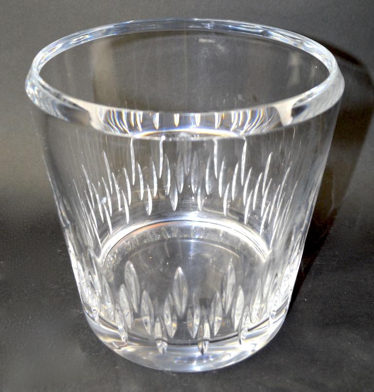 Crystal Champagne ice bucket. Heavy glass, with pressed decorative oval elements at base. Free of damage, unsigned.