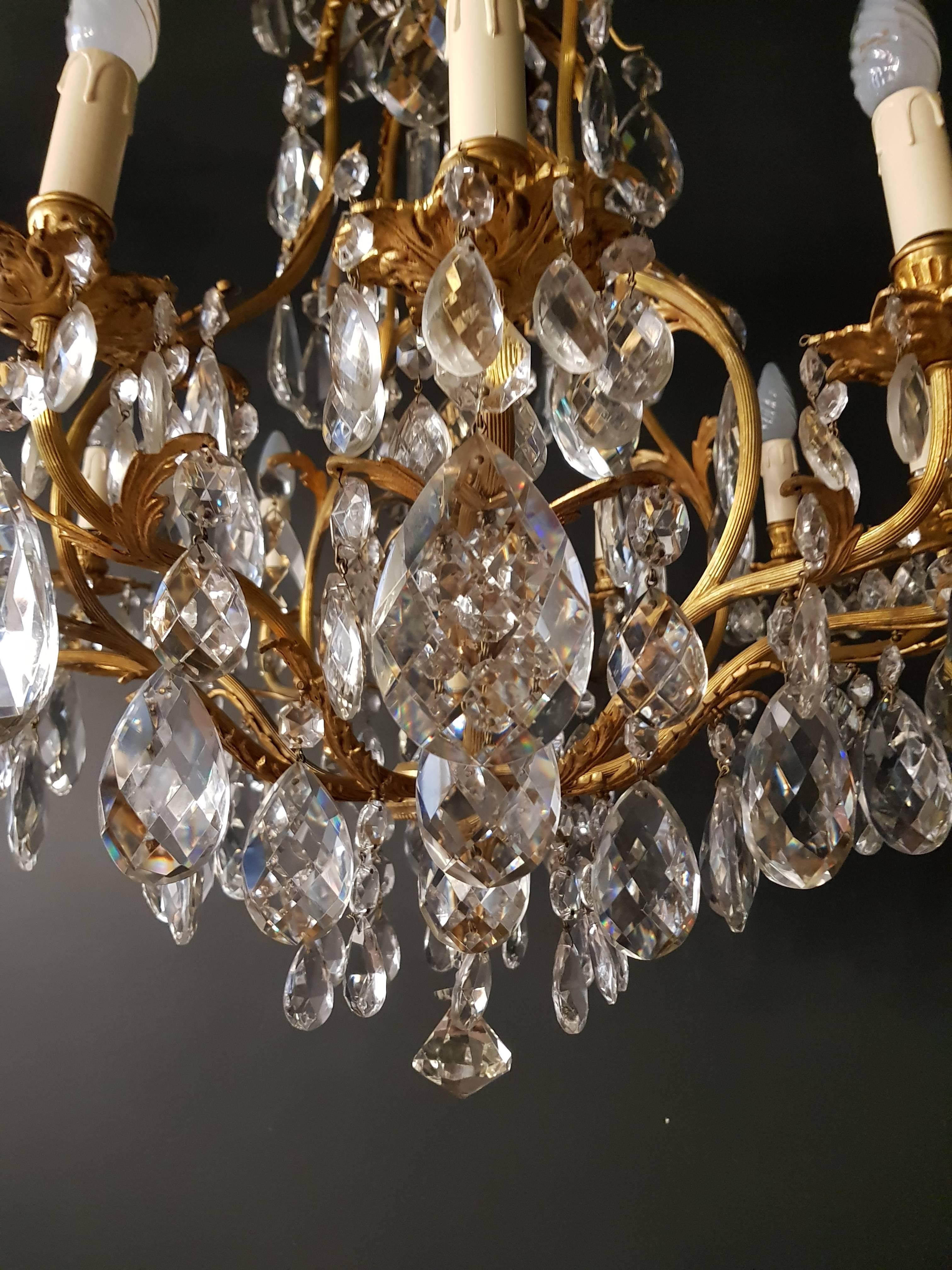 Crystal chandelier antique ceiling lamp lustre
Measures: Total height 150 cm, height without chain 100 cm, diameter 80 cm. Weight (approximately): 11kg.

Number of lights: Seven-light bulb sockets: eight x E12 and one x E27 material: Brass,