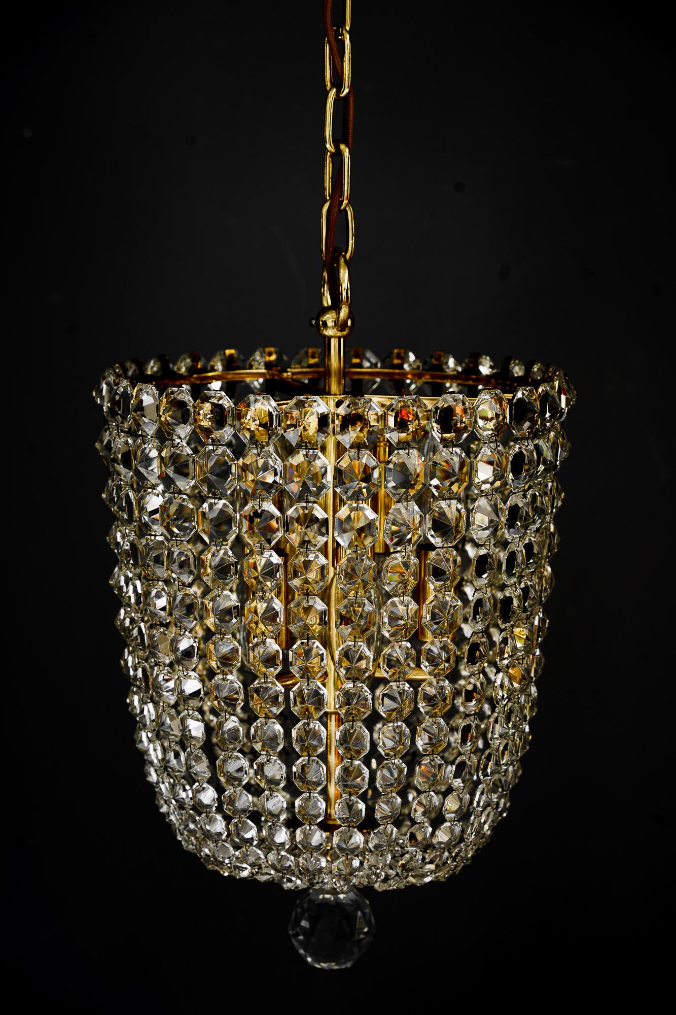 Crystal chandelier around 1960s by J.L.Lobmeyr ( signed ) 
Brass polishged and stove enameled