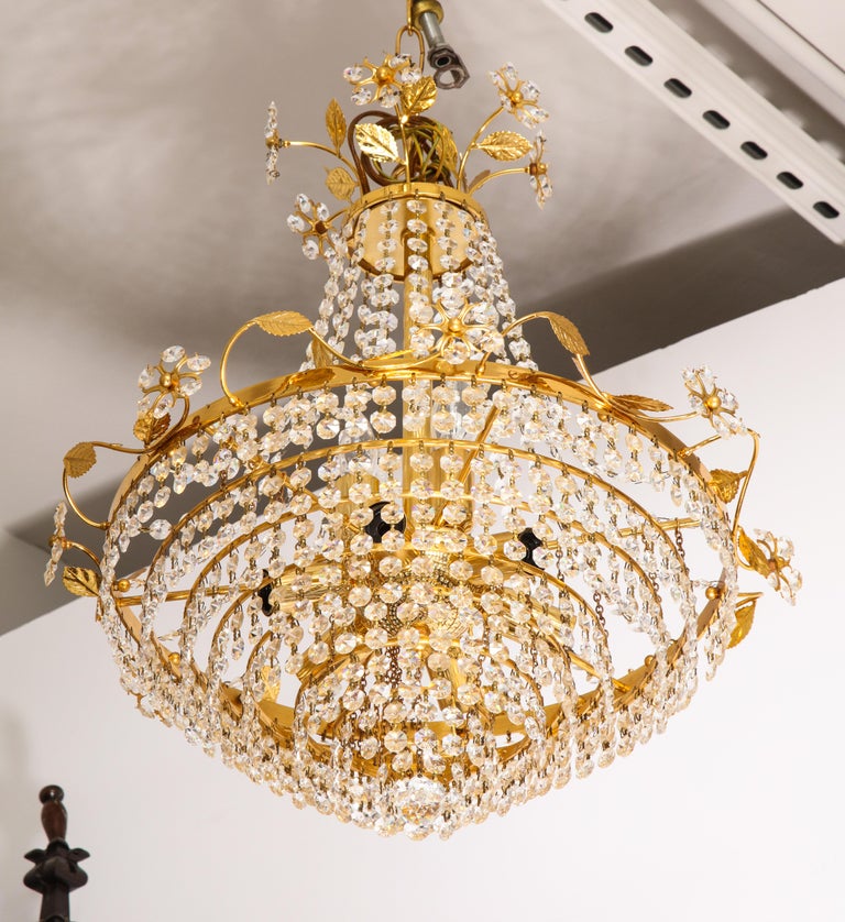 Tiered crystal and brass chandelier with flowers, vines and leaves by