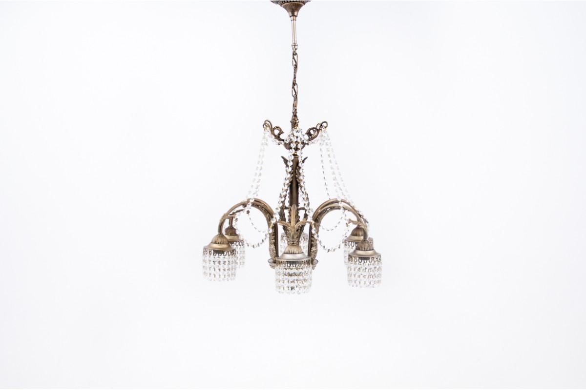 Crystal chandelier from France from the 1940s. The chandelier has been renovated, the electrical installation has been replaced.

Dimensions: height 87 cm / dia. 58 cm.