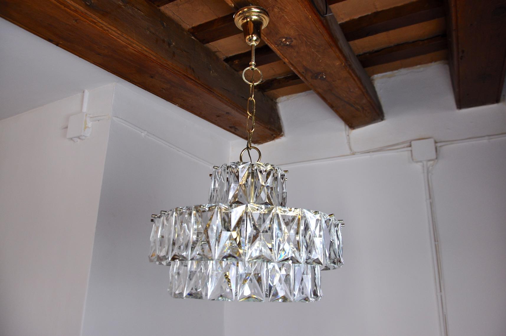 Rare and large kinkeldey chandelier designed and produced in Germany in the 70s. Structure in gilded metal made up of cut crystals distributed on 3 stages. Rare design object that will illuminate your interior wonderfully. Electricity verified,