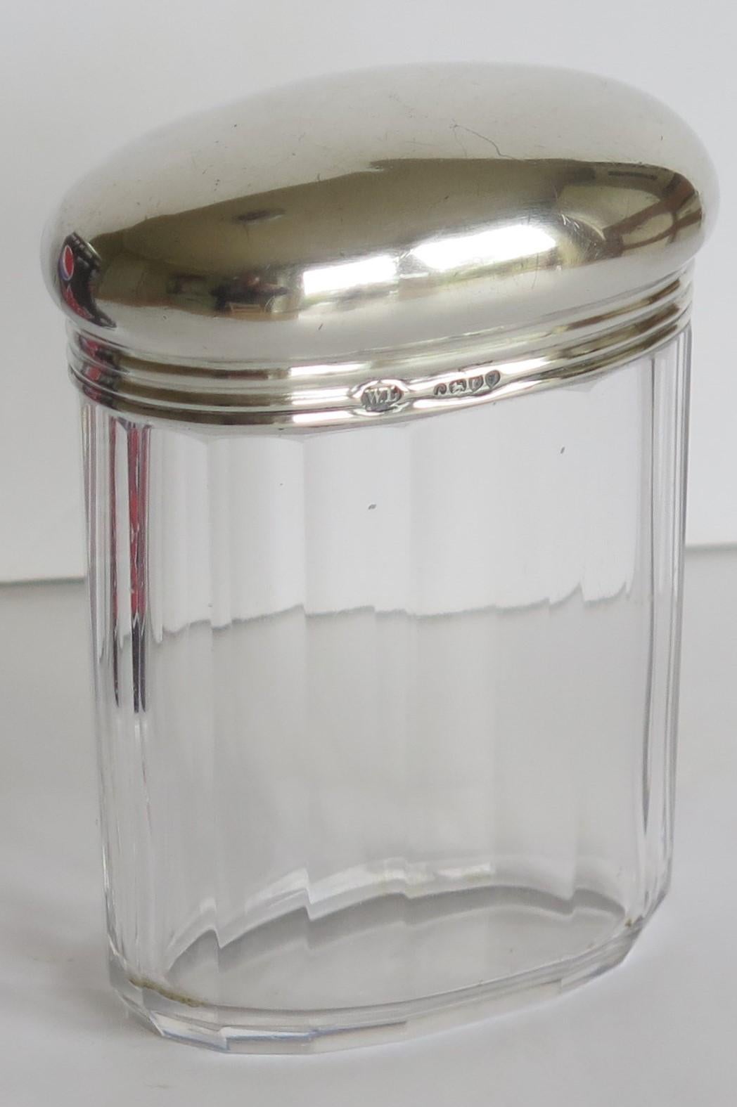 This is a attractive, high quality, 19th Century Victorian period, crystal cut glass bottle or Jar with a heavy sterling silver lid, handmade and fully hallmarked by William Leuchars, Piccadilly, London, 1881.

The bottle or jar sits on a small