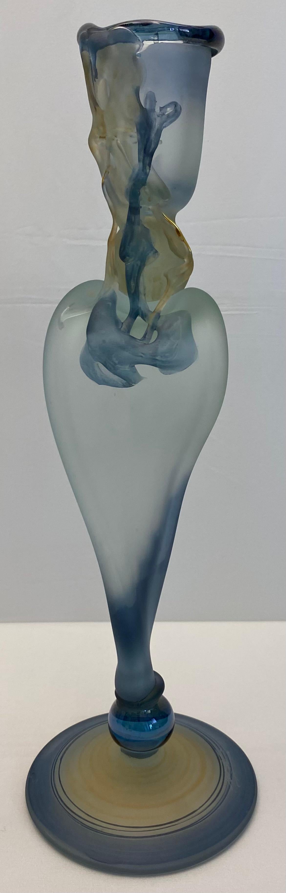 Unique Art Deco style hand-crafted, hand blown art glass stem vase. 

A beautiful and ornate Art Deco style trumpet vase, with spiral details. Perfect for a single bloom, this trumpet vase is as beautiful filled as it is empty.
Signed on the base.