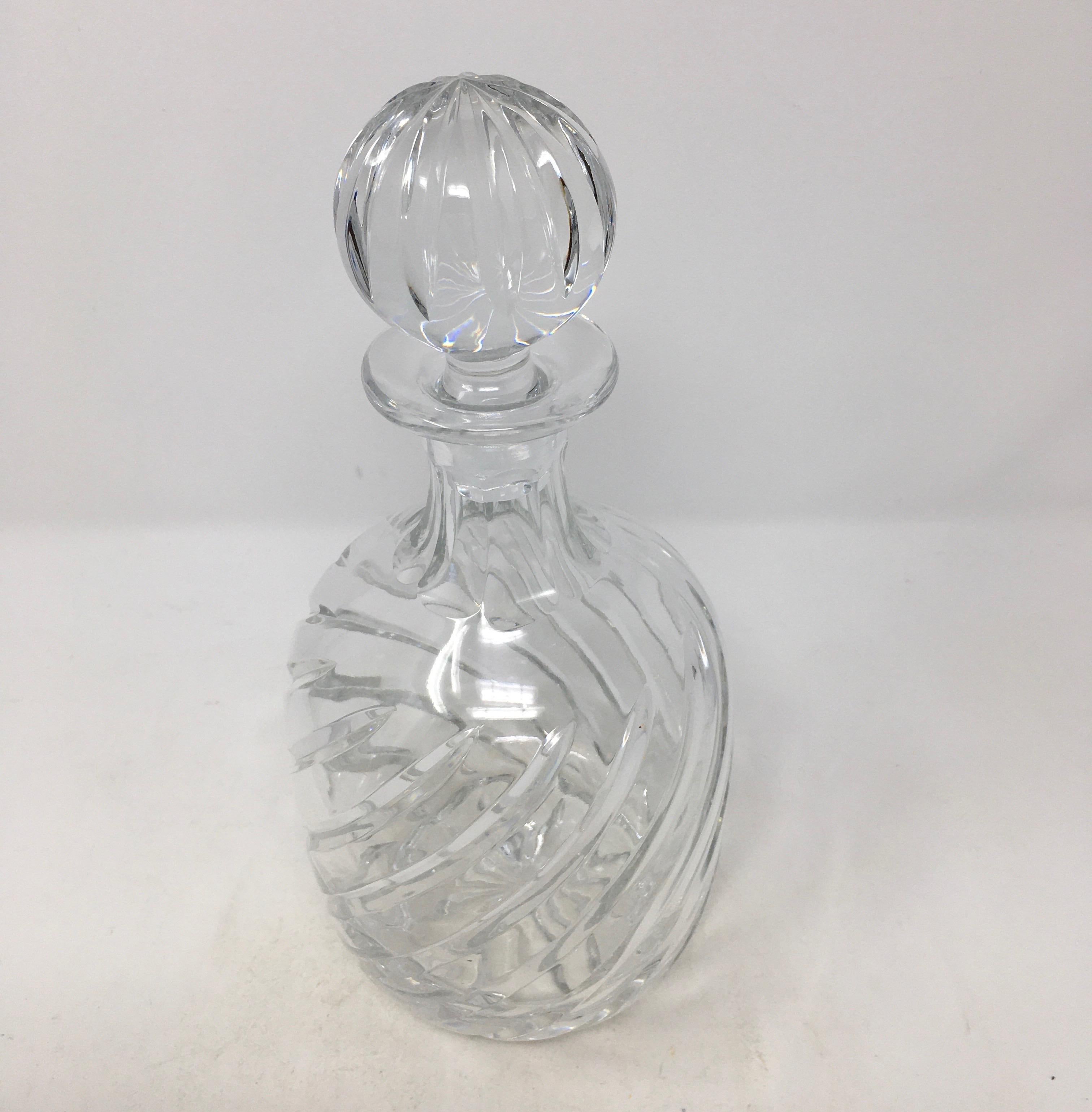 This is a 20th century cut crystal whiskey decanter with stopper. This beautiful decanter is ready for your bar or bar cart.


This piece weighs 3.5 lbs.