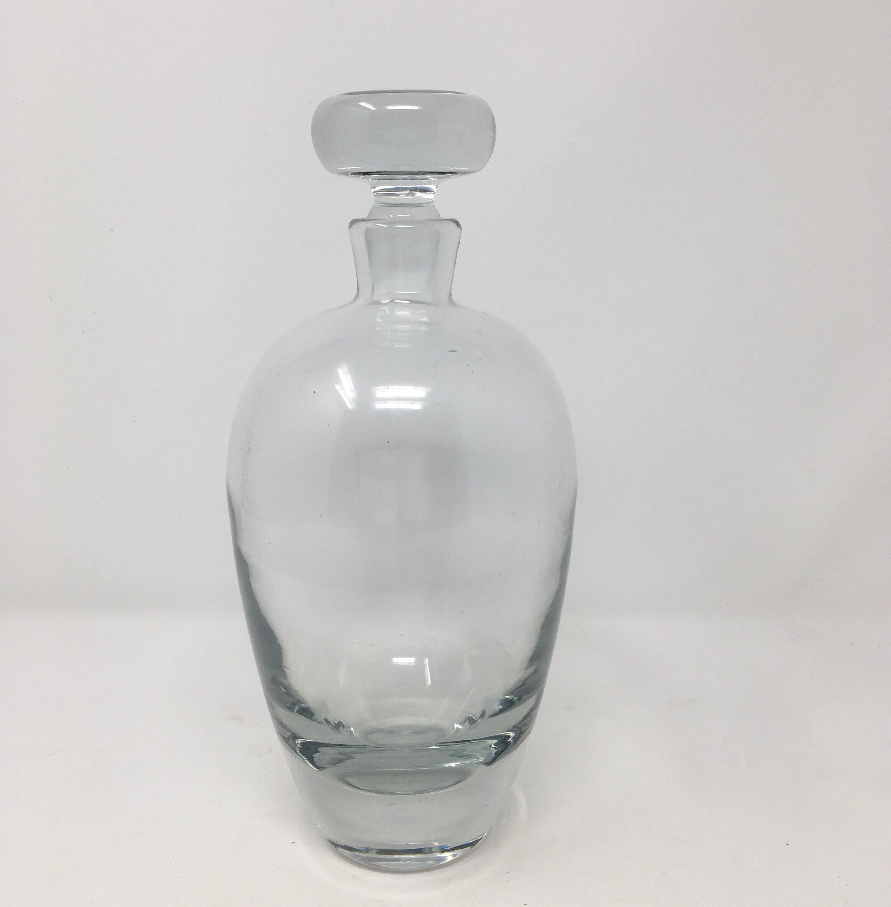 This is a 20th century crystal decanter with stopper. This beautiful decanter is ready for your bar or bar cart.