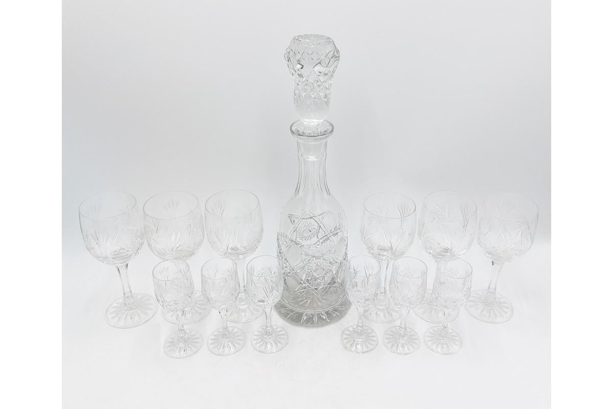 Crystal liqueur set carafe + 6 wine glasses + 6 liquor glasses
Very good condition.
Made in Poland in the 1960s.
Decanter : H 36,5cm, D 10cm 
Wine Glass : H 17cm, D 6,5cm
Liquor glass : H 12cm, D 4cm.