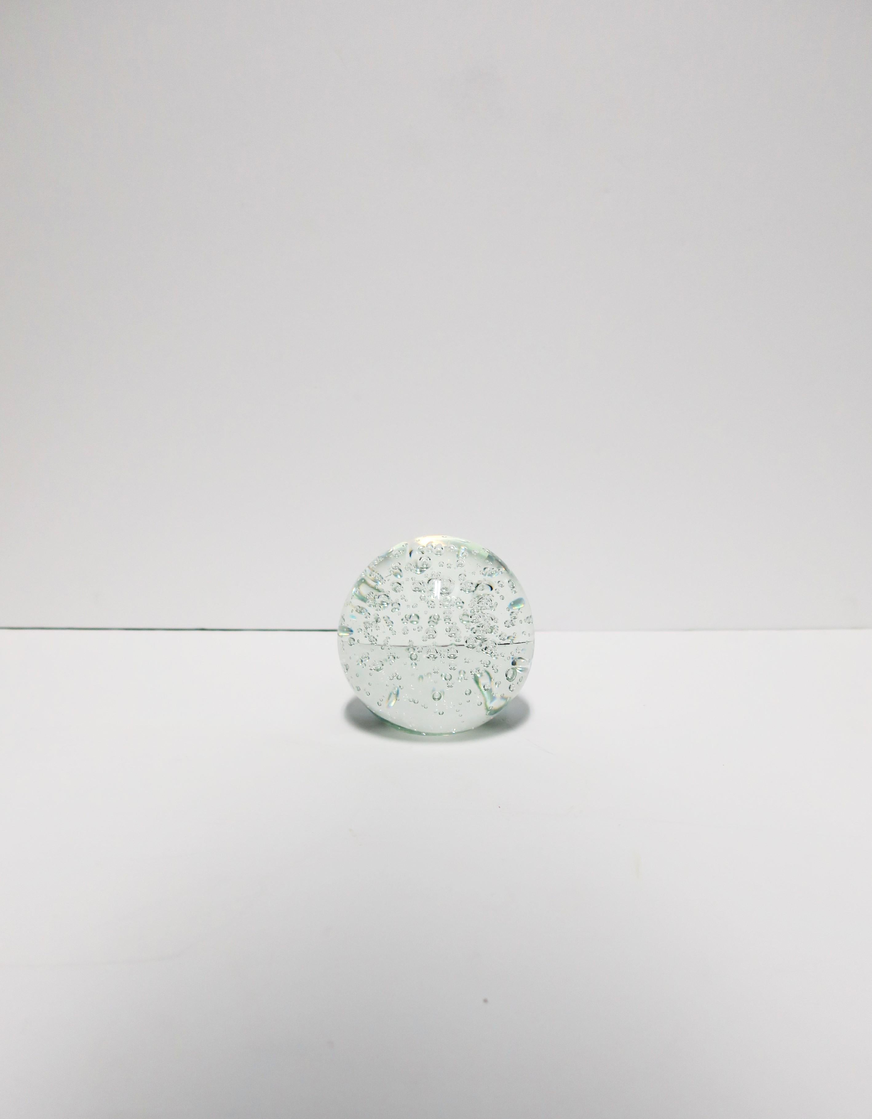 A round crystal decorative ball sphere with bubble design. Piece has flat bottom for stability. 
Dimensions: 3.63