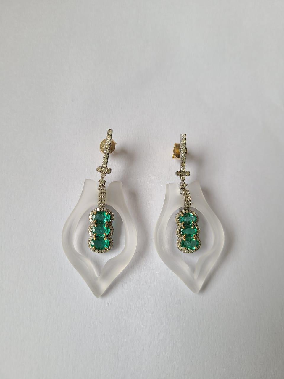 A very beautiful and one of a kind pair of Victorian style, Crystal, Emerald Dangle Earrings set in 14K Gold, Sil & Diamonds. The weight of the Crystal 38.57 carats. The weight of the Emeralds is 2.38 carats. The Emeralds are completely natural