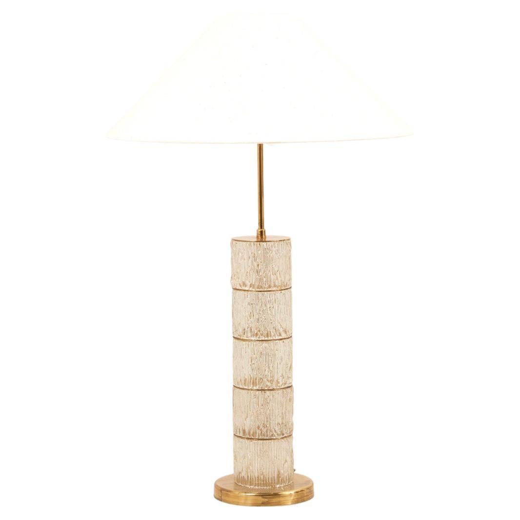 Floor lamp with crystal base and brass elements, 1970s. The diameter given applies to the base. Please note: Lamp should be fitted professionally in accordance to local requirements. The Lamp comes without the shade.