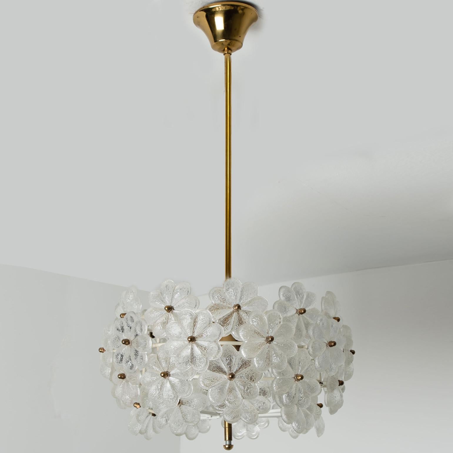 Stunning chandelier with crystal flower glass over a brass frame, designed and made by Ernst Palme in Germany, 1970s.
The sculptural chandelier has the design of a bouquet of a large number of textured glass flowers.

Diameter 15.75