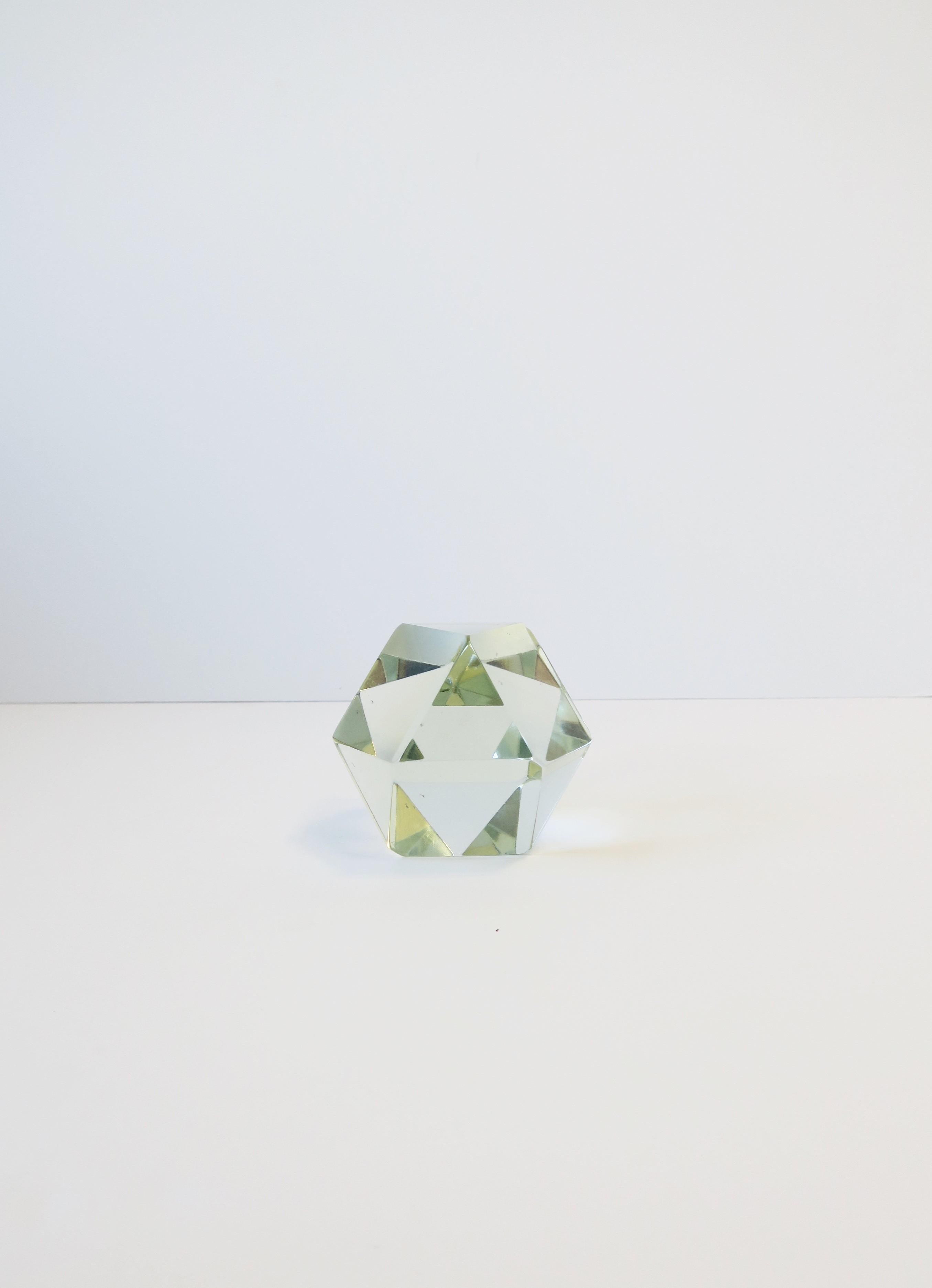 A beautiful crystal geometric paperweight or decorative object, circa late-20th century. A great decorative object (as shown) and a great piece for a desk, office, library, etc. Very good condition as shown. No chips noted. 

Other items shown in