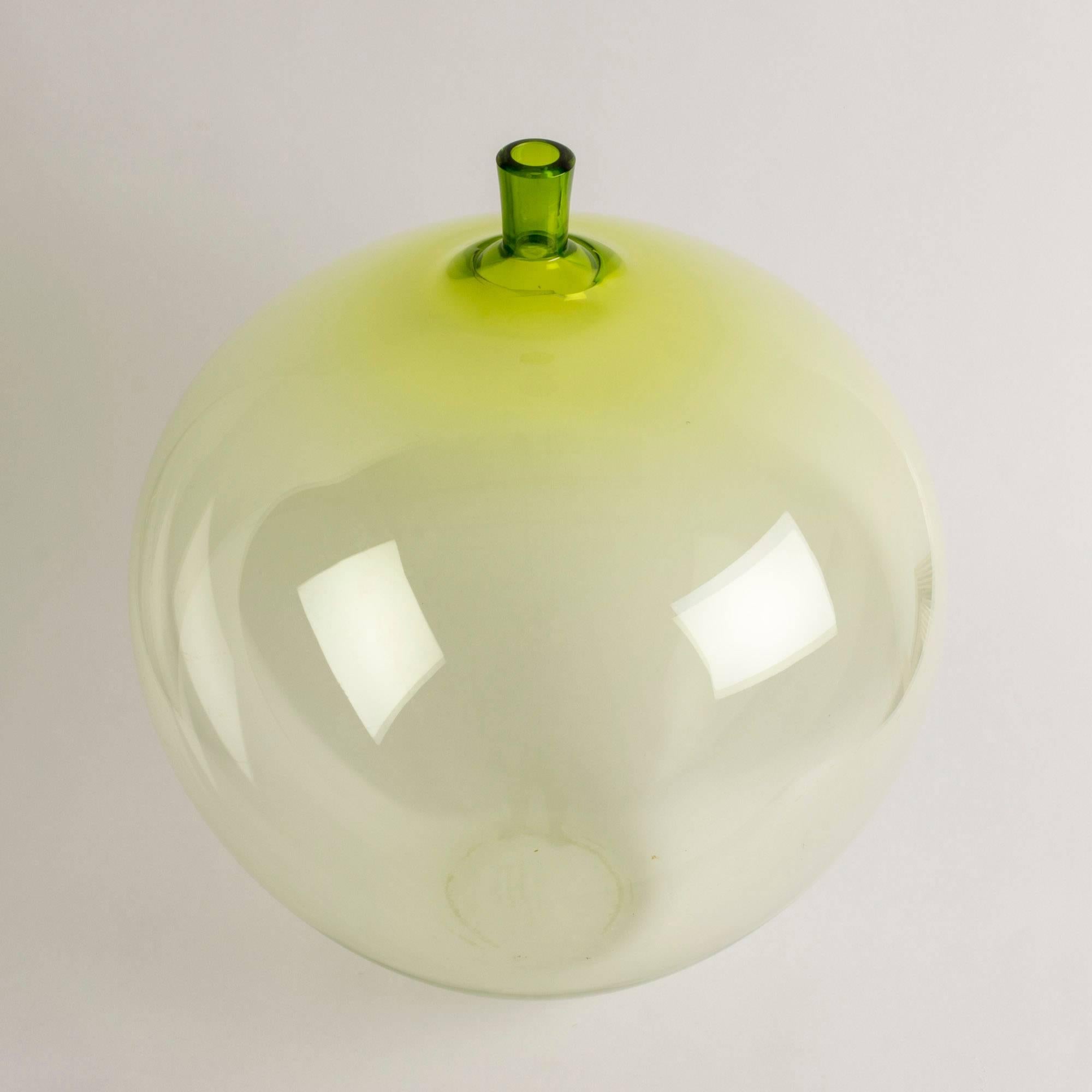 Stunning crystal glass apple by Ingeborg Lundin, tinted crispy green. The apple is an iconic piece, composed in 1955 and was first presented at the H55 fair in Helsingborg, Sweden, where it caused a sensation. The design is the epitome of Lundin’s