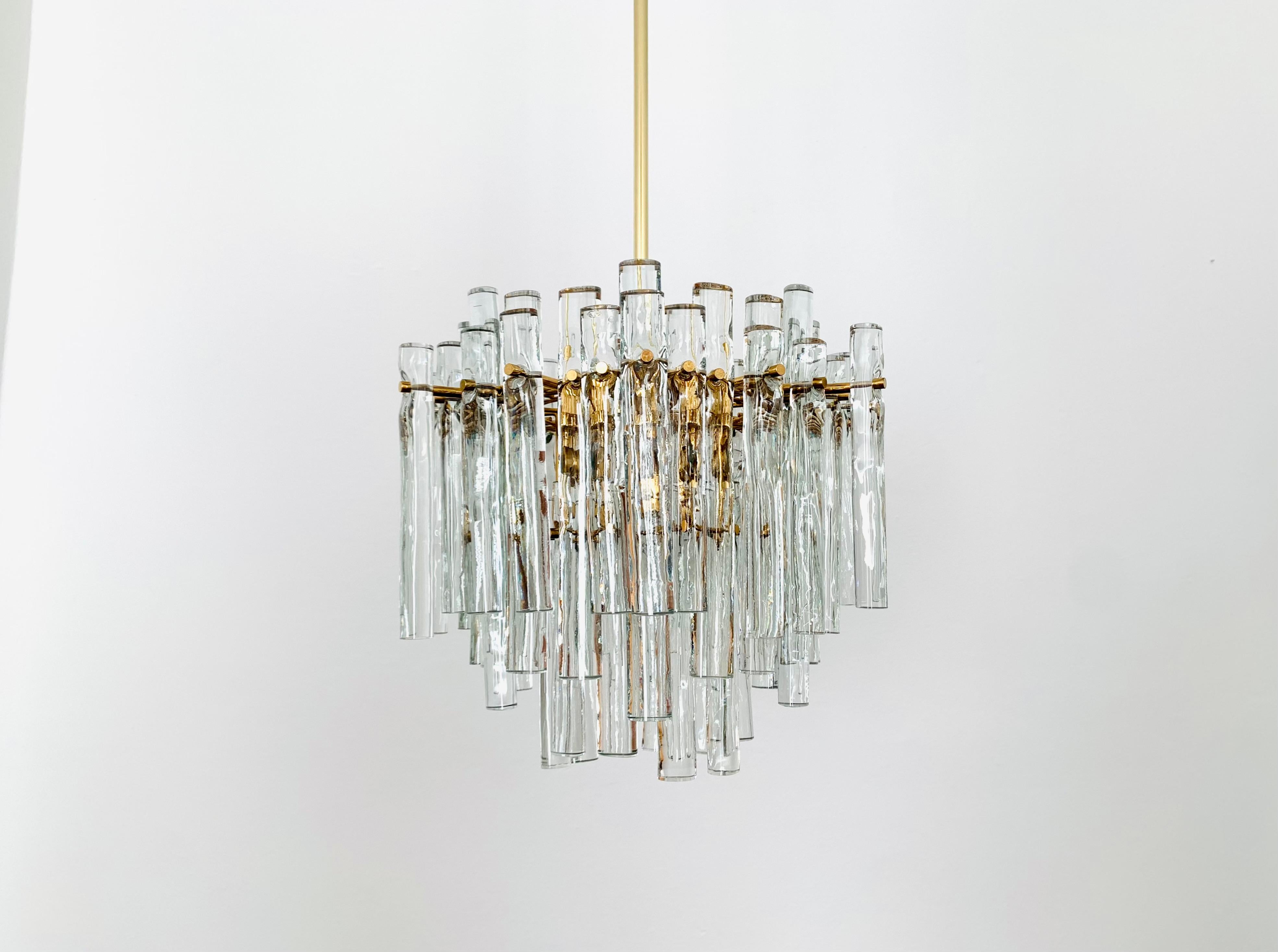 Extremely beautiful chandelier from the 1960s.
The high-quality workmanship and the very noble material impress at first sight.
Exceptionally beautiful design.
The lamp spreads a fantastic play of light in the room.

Manufacturer: