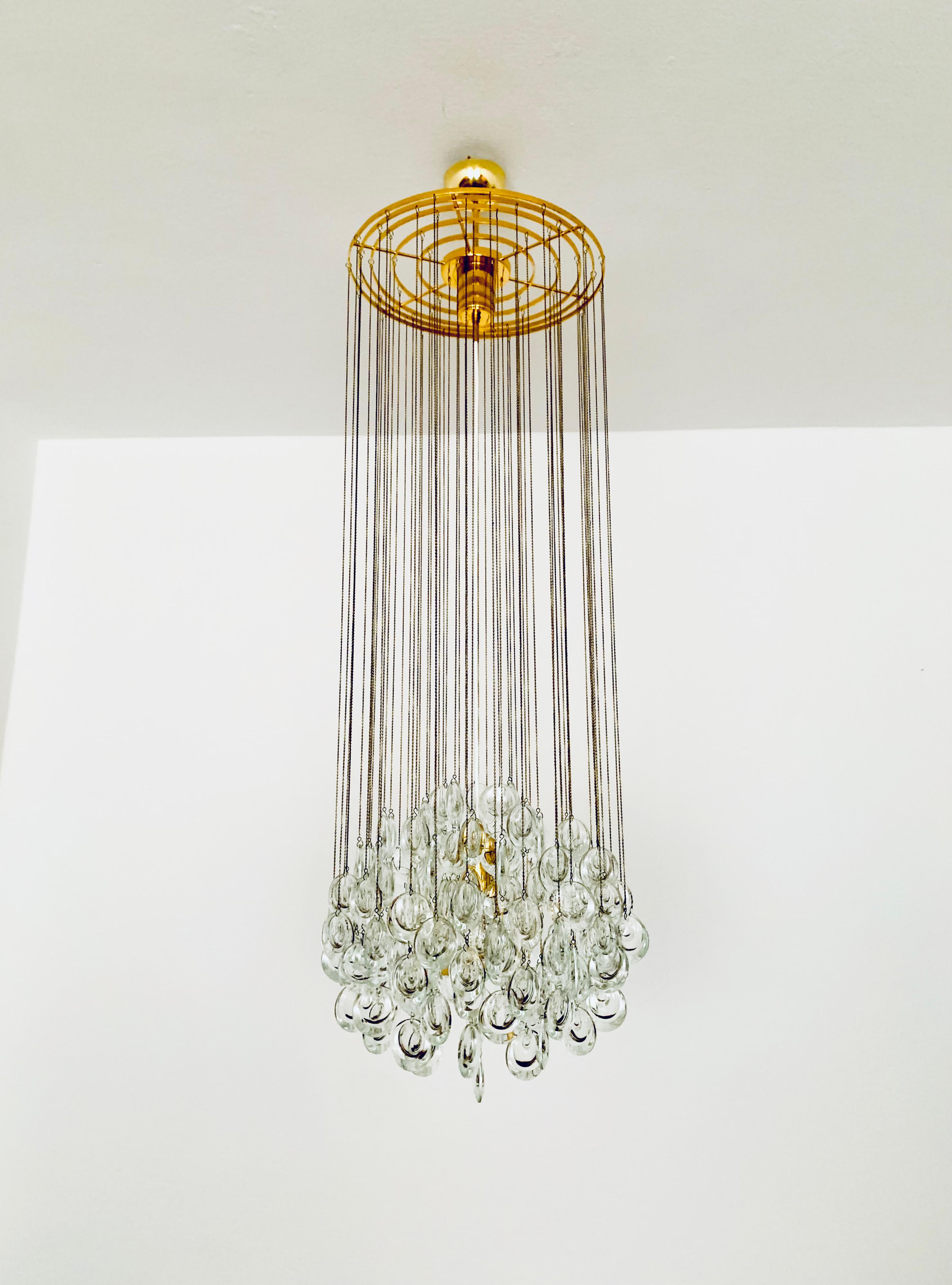 Stunningly beautiful and very rare chandelier from the 1970s.
The excellent workmanship and the very noble material impress at first glance.
Exceptionally beautiful design.
The lamp spreads a spectacular play of light in the