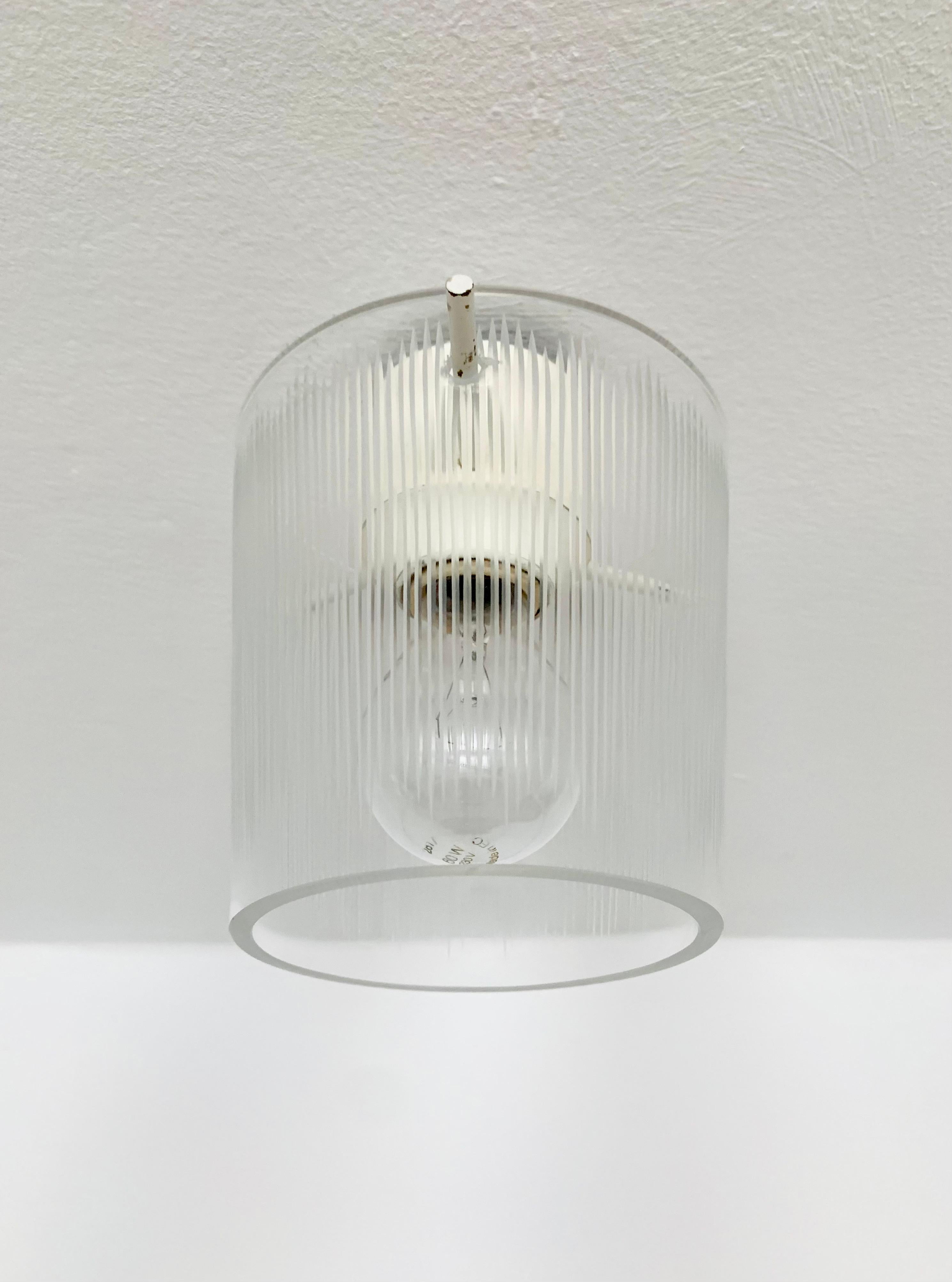 Wonderful small crystal glass ceiling lamp from the 1950s.
Beautiful, reduced design and a real eye-catcher in every home.
The cut glass creates a spectacular lighting effect.

Condition:

Very good vintage condition with minimal age-related signs