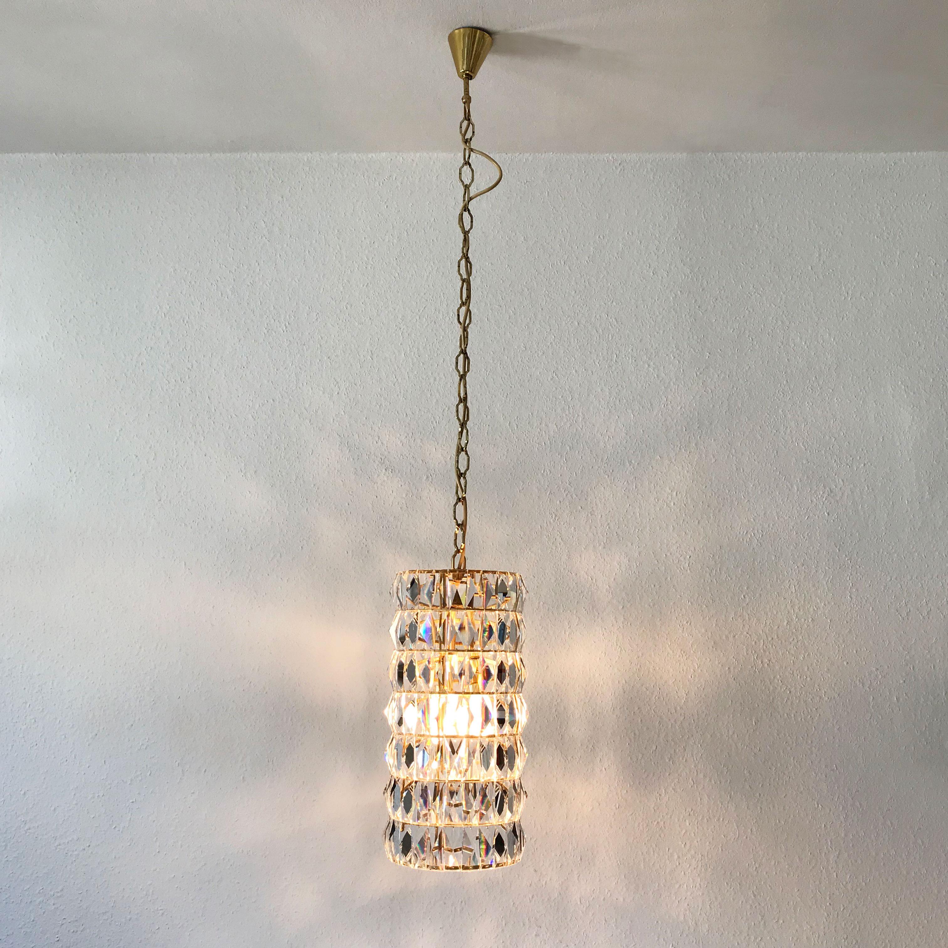 Exceptional Mid-Century Modern pendant lamp or chandelier. Manufactured by Bakalowits & Söhne, Vienna, Austria in 1960s. 

Executed in facet cut crystal glass and gilt brass, the chandelier needs 3 x E14 / E12 Edison screw fit bulbs. It is wired, in