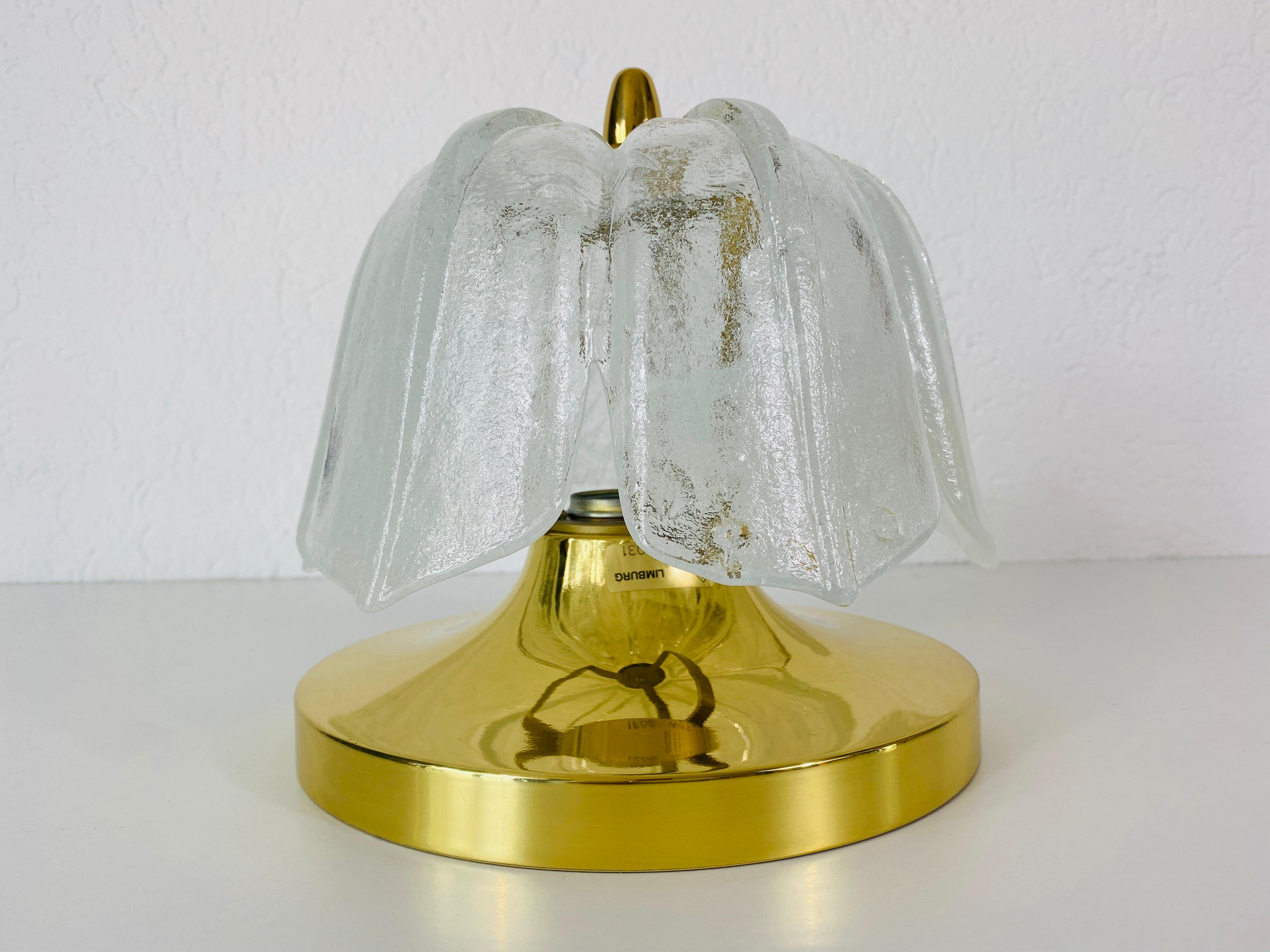 Flushmount by Glashütte Limburg made in Germany in the 1960s. It is fascinating with its crystal glass, which is typical for the German brand. The round top of the light is made of brass.

The light requires one E27 light bulb. Very good vintage